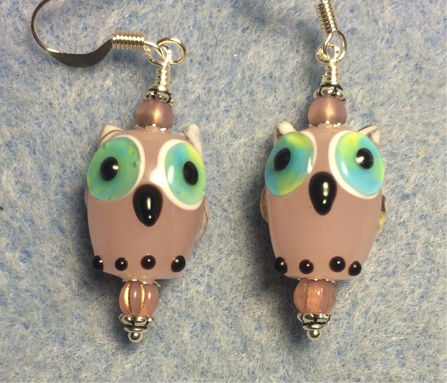 Light pink lamp work owl bead earrings adorned with pink Czech glass beads.