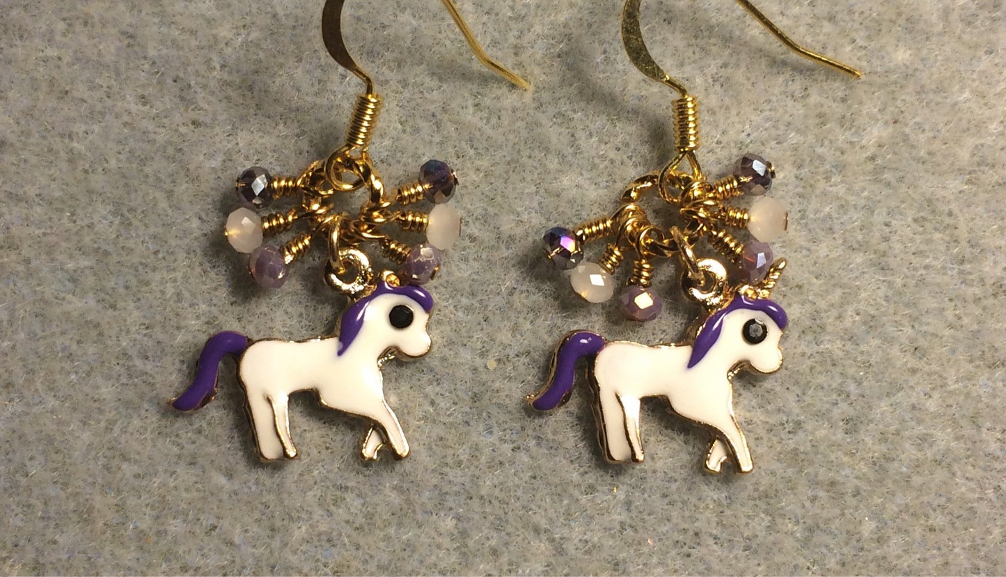 Small white and purple enamel unicorn charm earrings adorned with tiny dangling purple and white Chinese crystal beads.