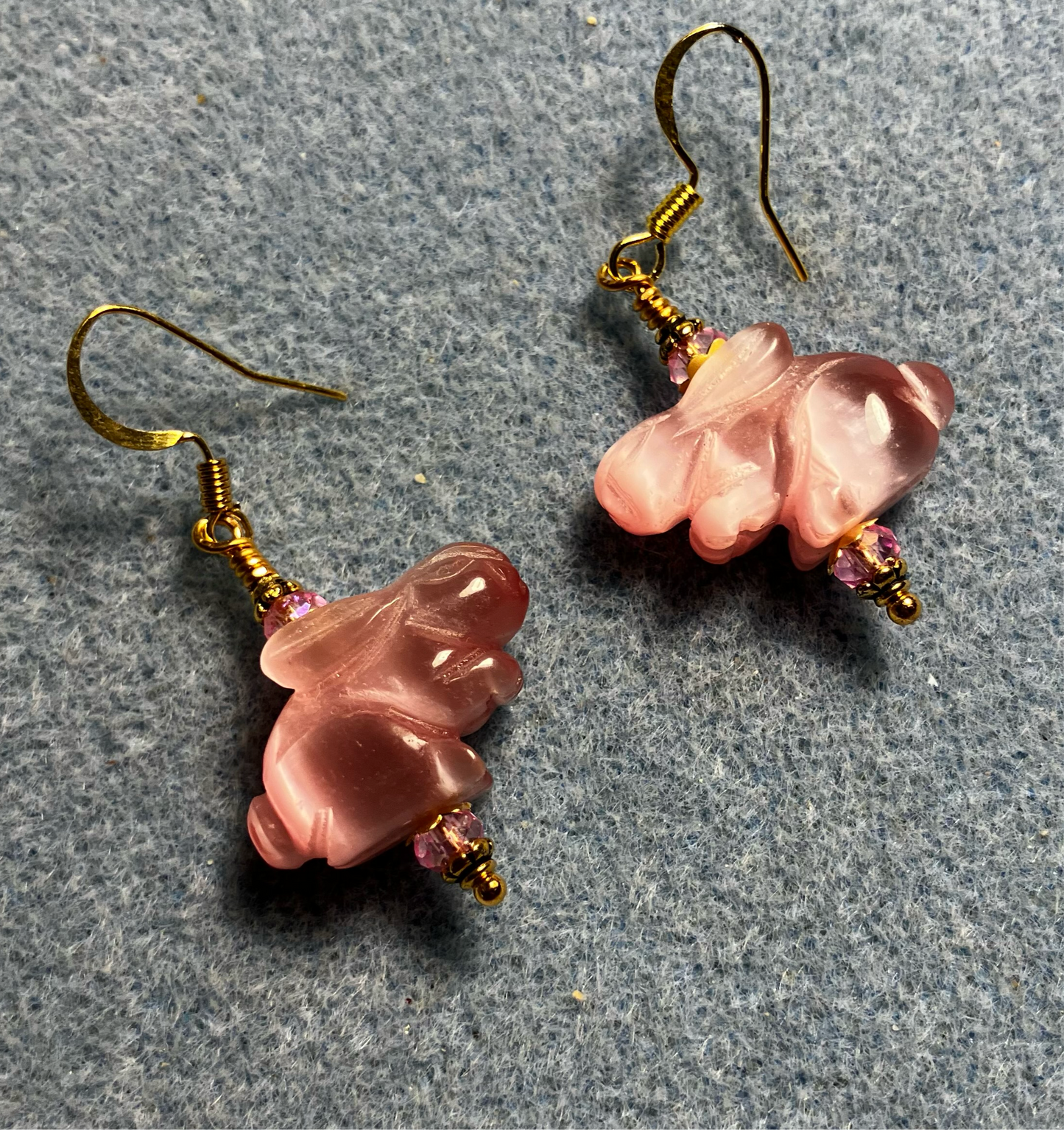 Pink fiber optic (cat’s eye) rabbit bead earrings adorned with pink Chinese crystal beads.