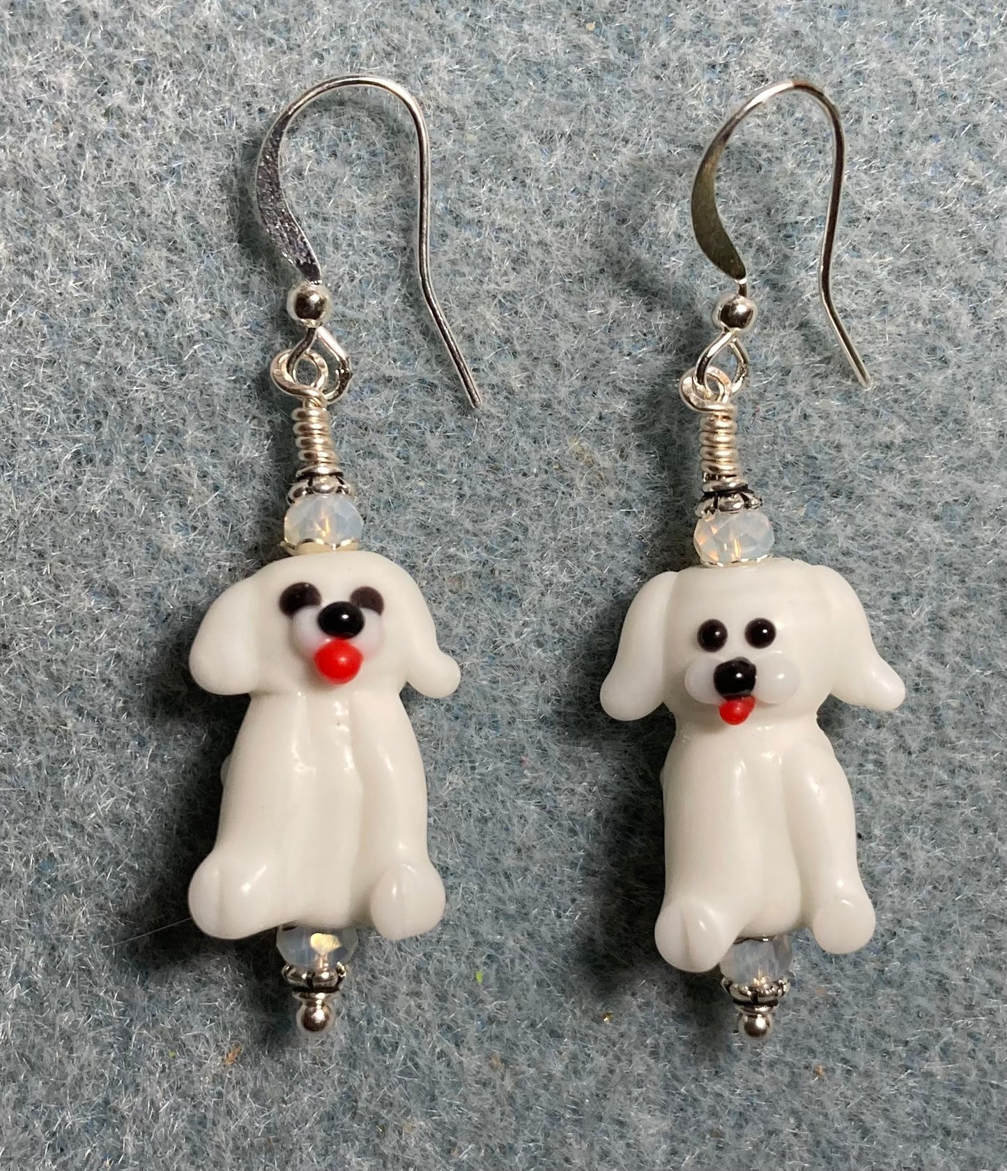 White lamp work puppy dog bead earrings adorned with white Chinese crystal beads.
