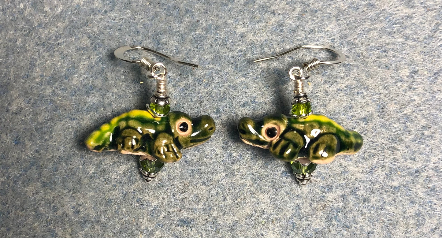 Small olive green ceramic alligator bead earrings adorned with olive green Chinese crystal beads.