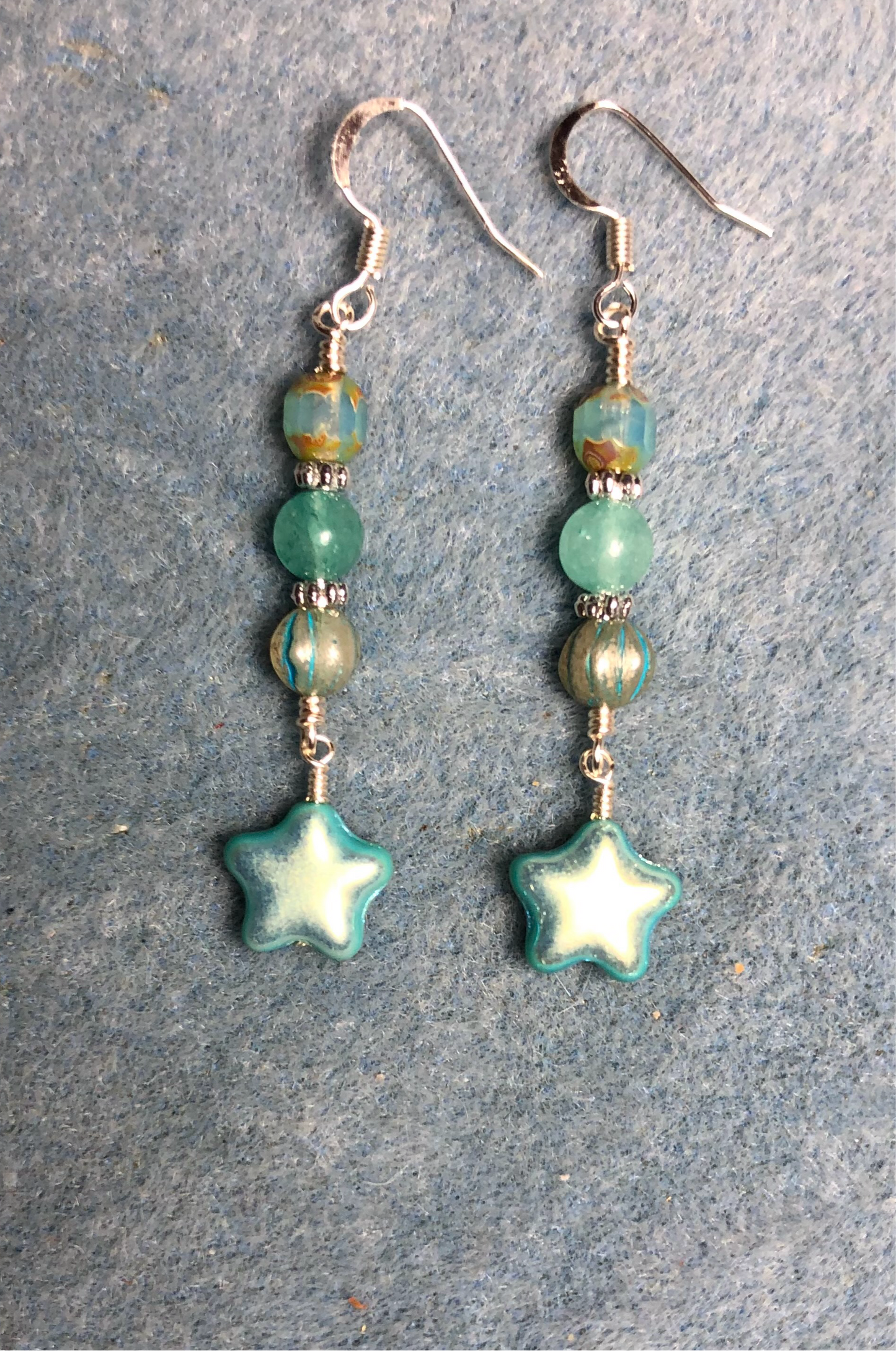 Small metallic turquoise Czech glass star bead earrings adorned with turquoise Czech glass beads.