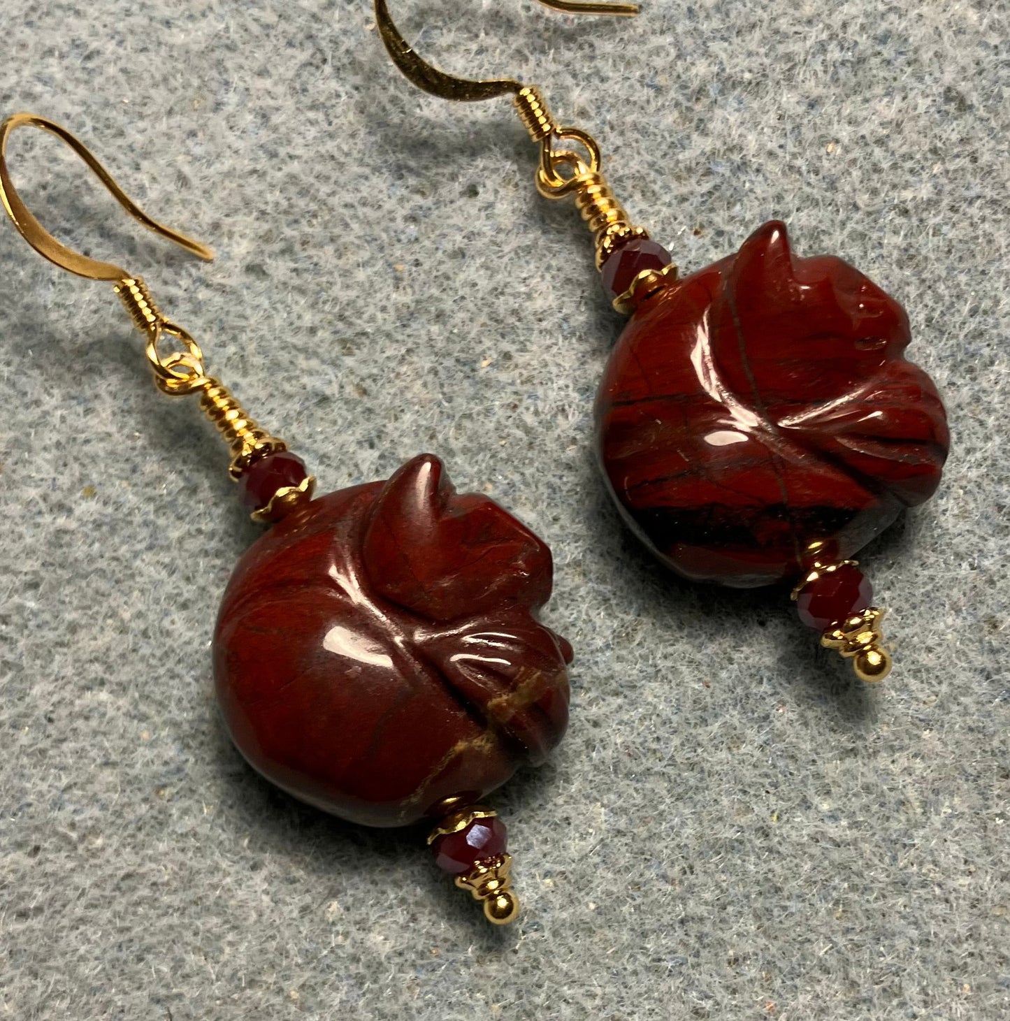 Dark red poppy jasper gemstone sleeping cat bead earrings adorned with dark red Chinese crystal beads.