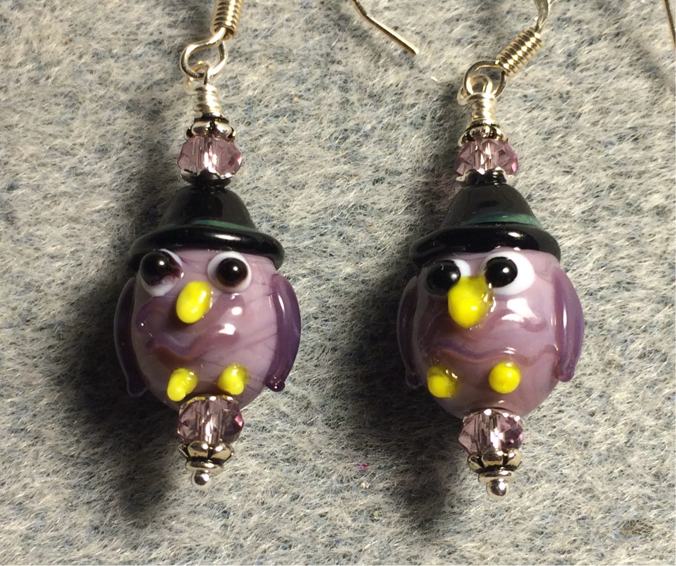 Small violet lamp work Halloween owl bead earrings adorned with violet Chinese crystal beads.