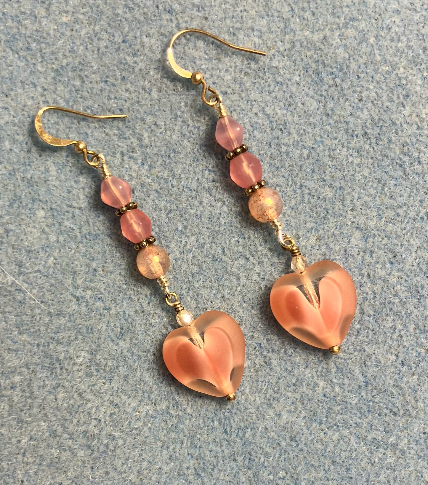 Pink Czech glass heart bead earrings adorned with pink Czech glass beads.