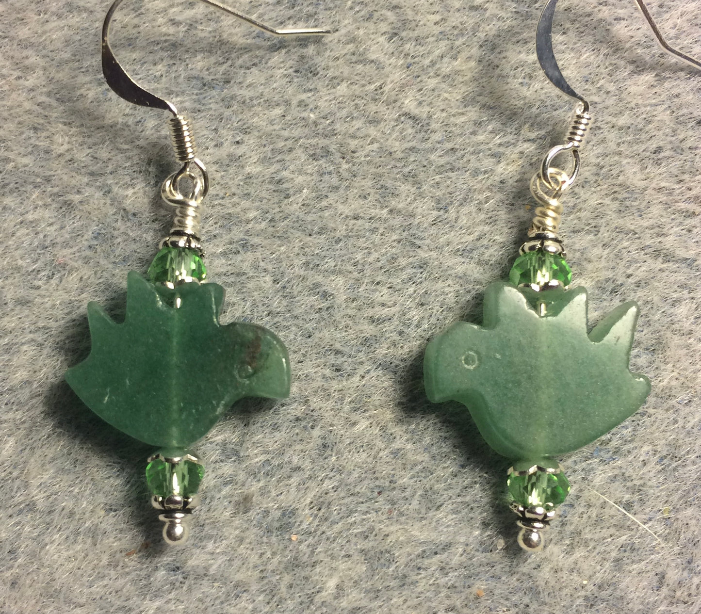 Green aventurine gemstone dove bead earrings adorned with green Chinese crystal beads.