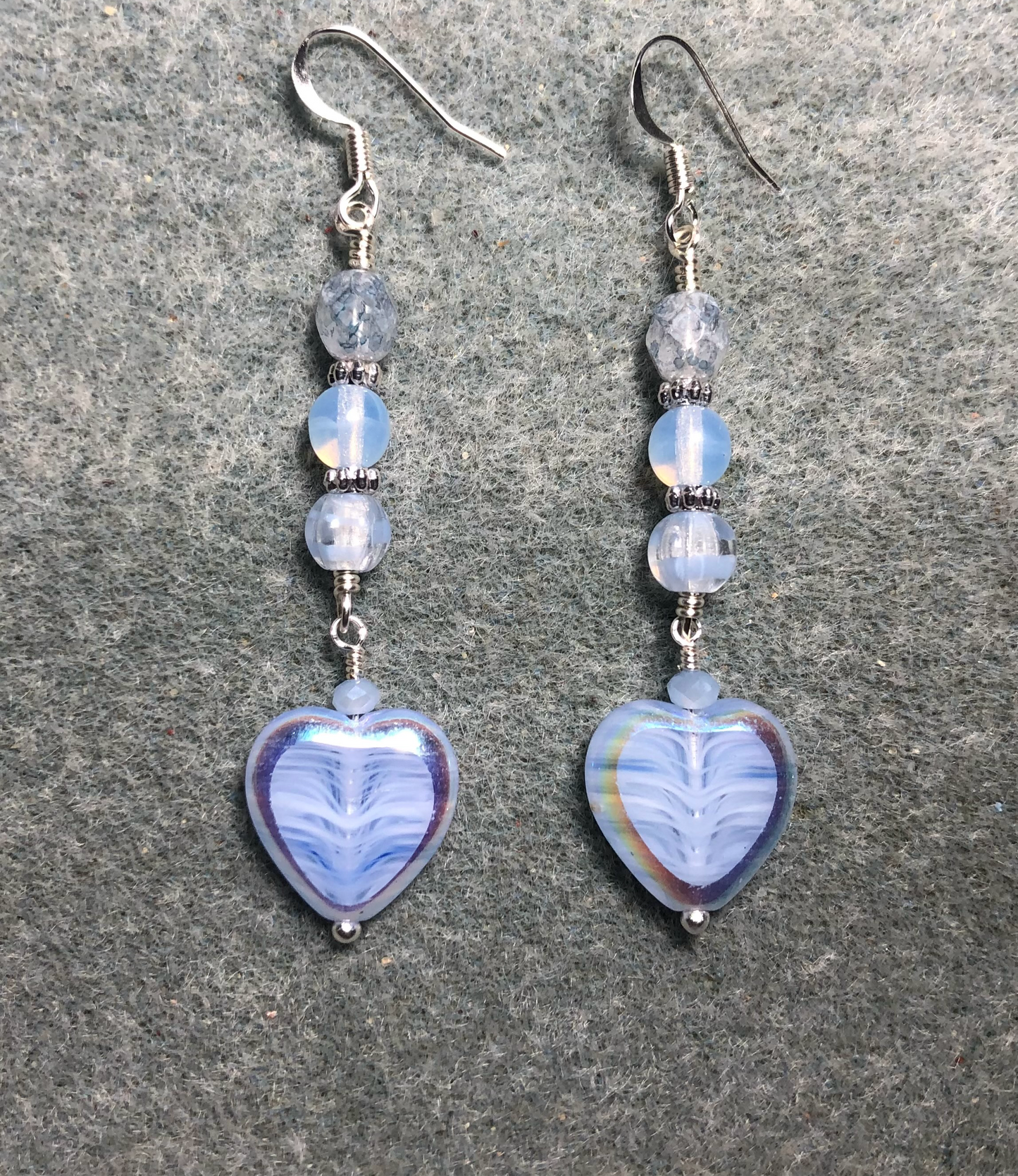Light blue Czech glass heart bead earrings adorned with light blue Czech glass beads.