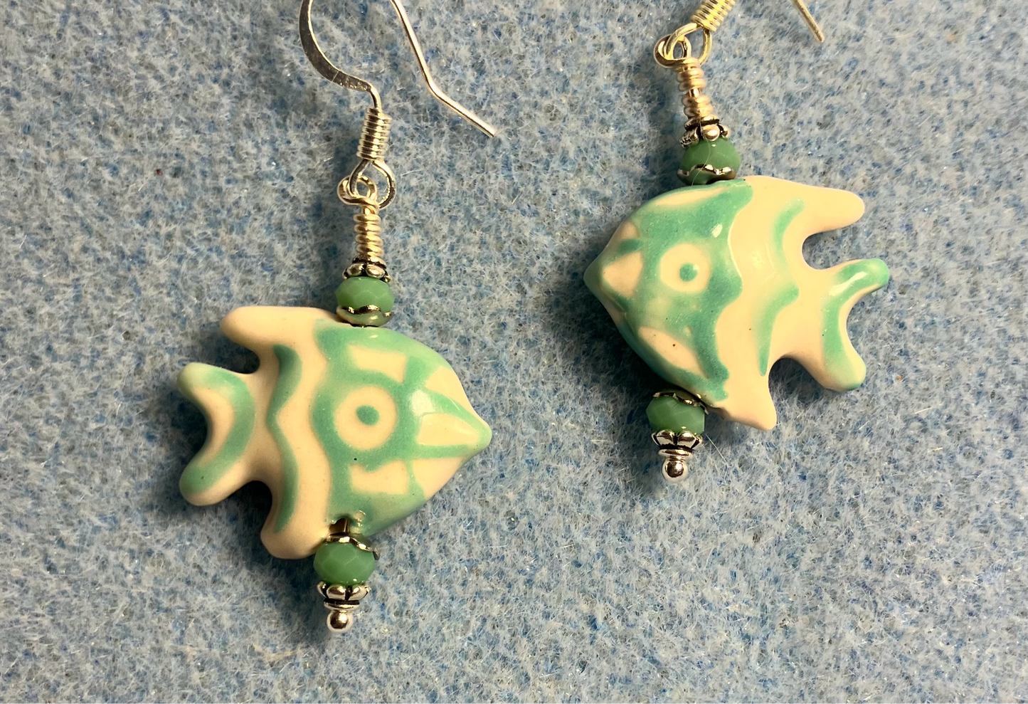 Turquoise and white ceramic angelfish bead earrings adorned with turquoise Chinese crystal beads.