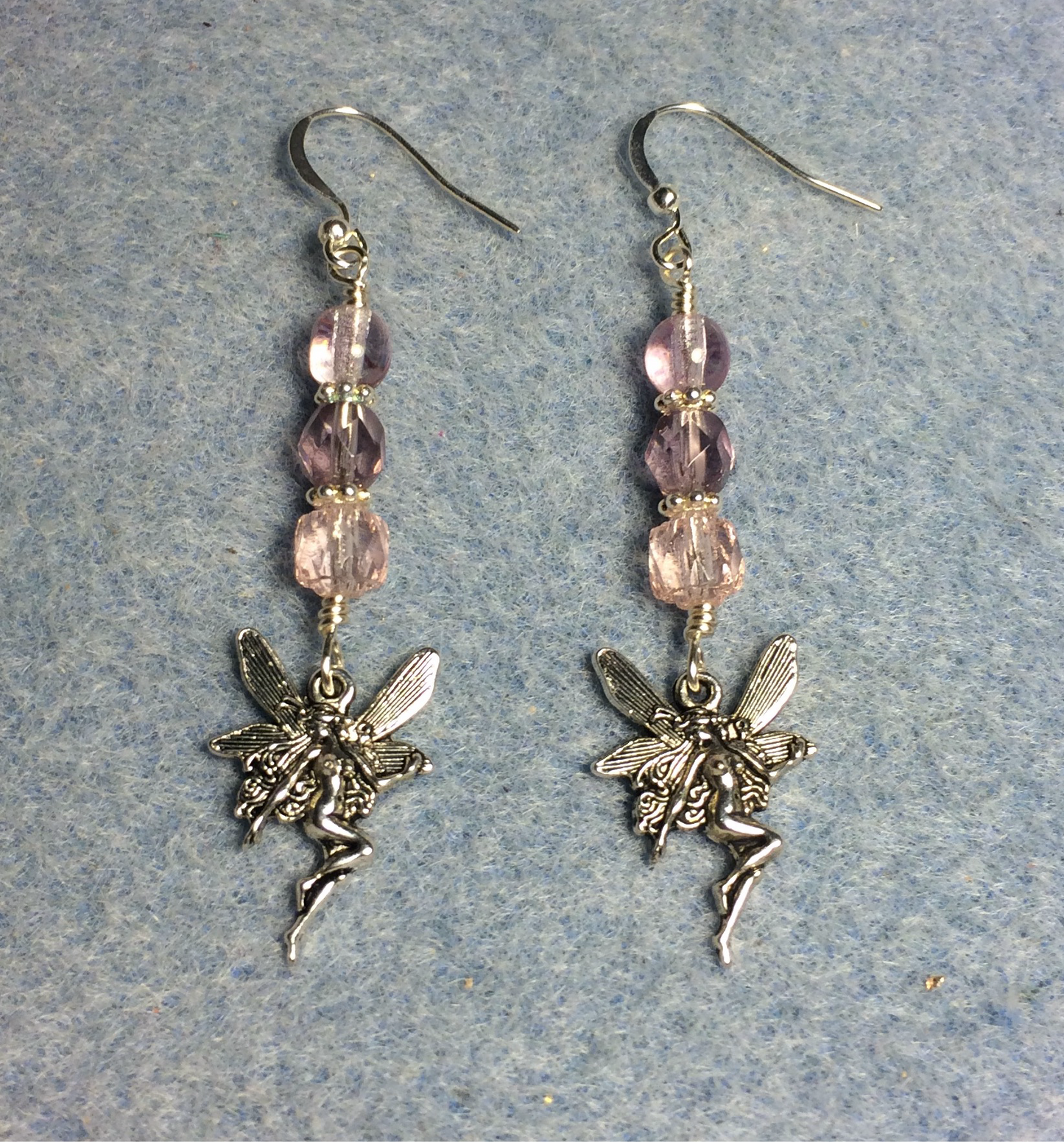 Silver fairy charm earrings adorned with light pink Czech glass beads