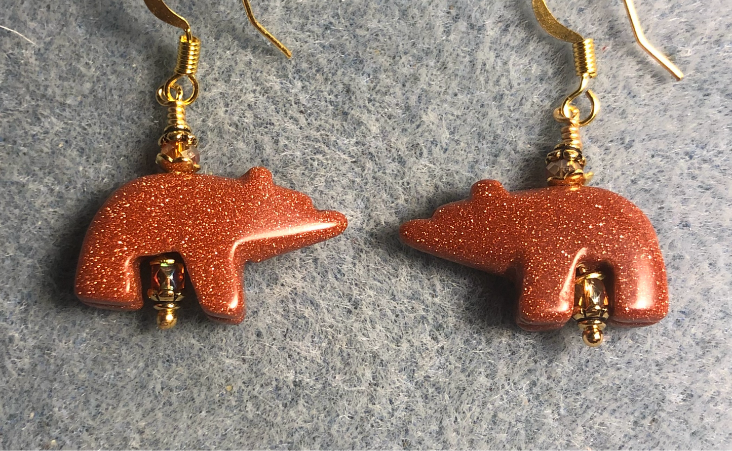 Orange goldstone gemstone bear bead earrings adorned with orange Chinese crystal beads.