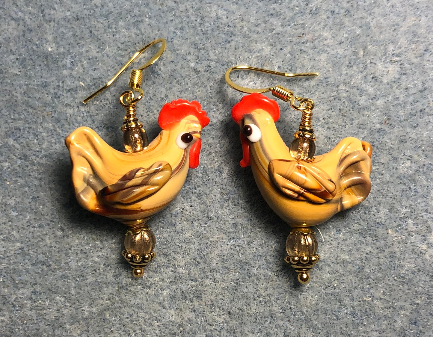 Tan lamp work chicken bead earrings adorned with tan Czech glass beads.