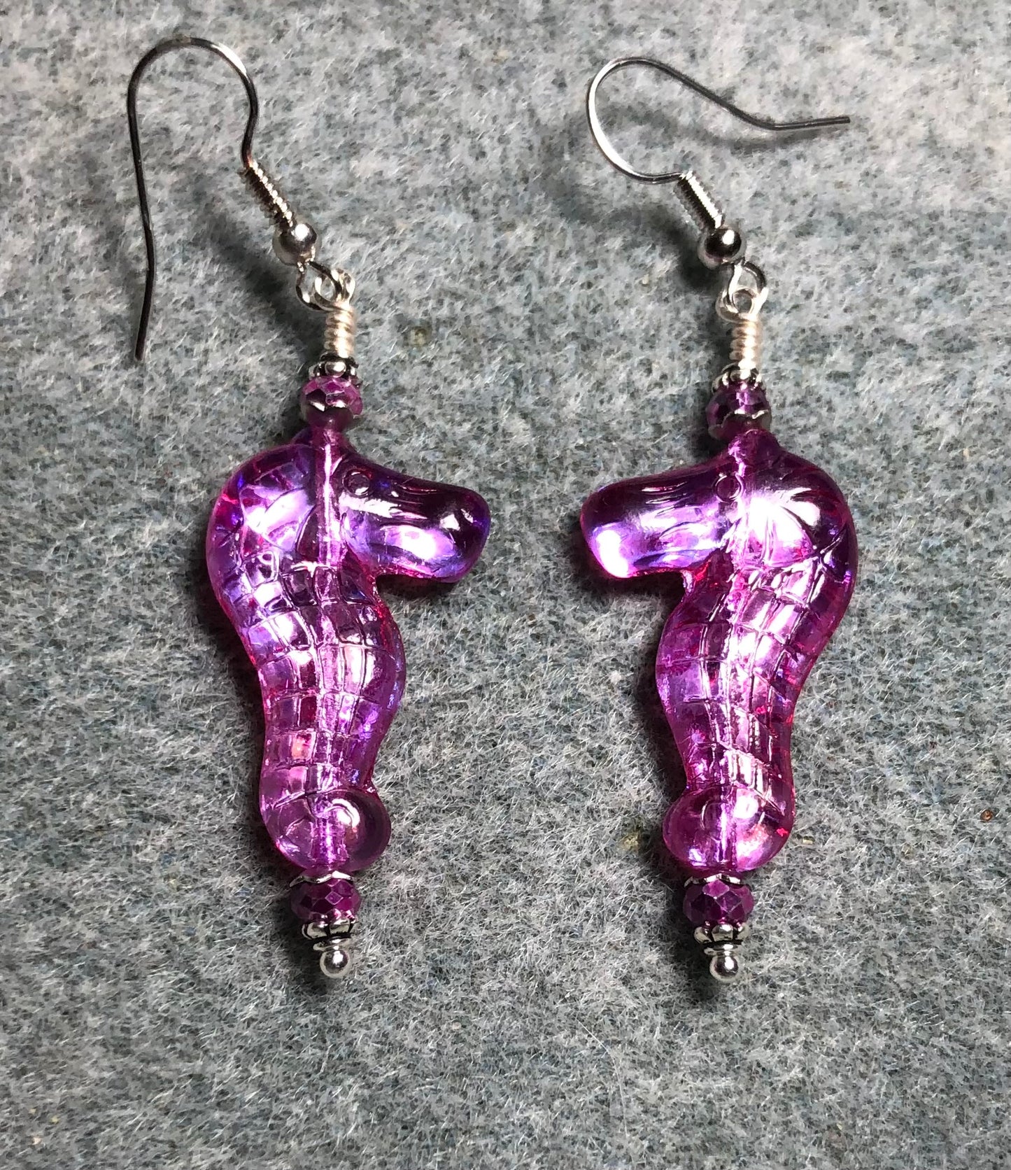 Shimmery purple pink Czech glass seahorse bead earrings adorned with sparkly purple Chinese crystal beads.
