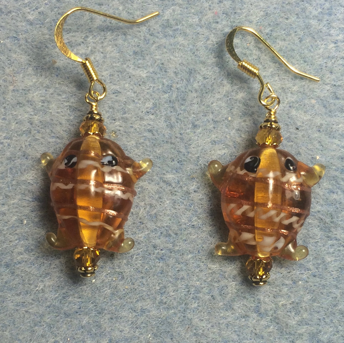 Amber lamp work frog bead earrings adorned with amber Chinese crystal beads.