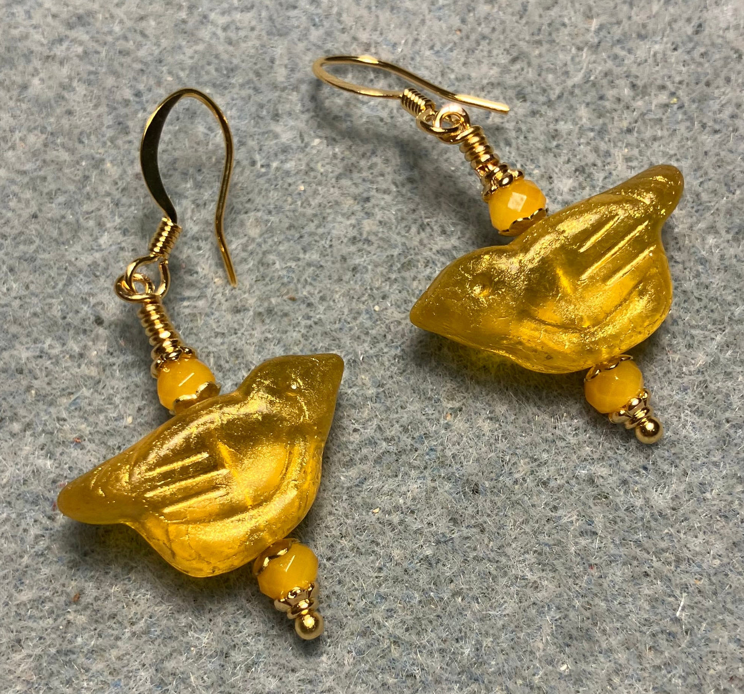 Lemon yellow Czech glass bird bead earrings adorned with lemon yellow Chinese crystal beads.