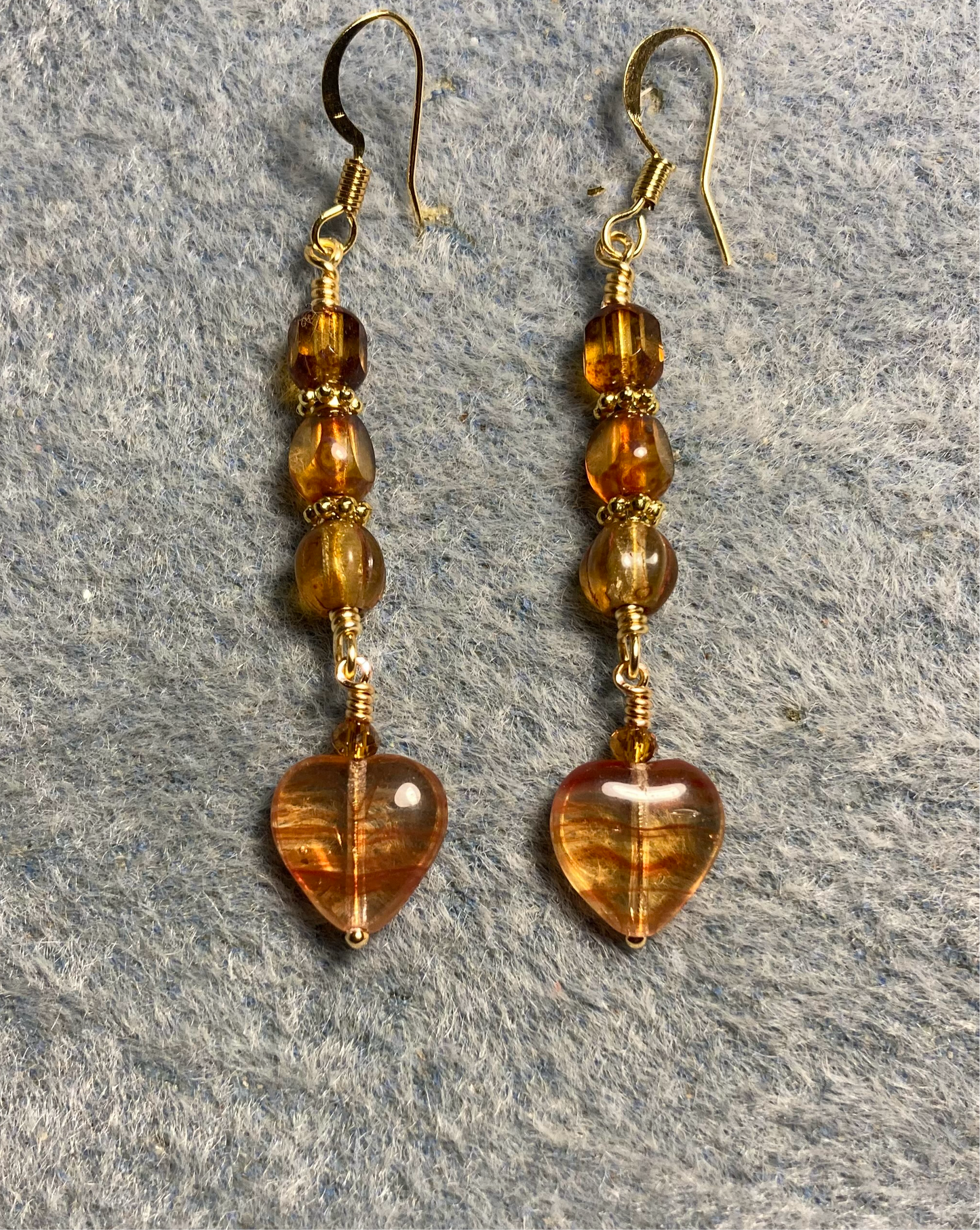 Small orange brown striped Czech glass heart bead earrings adorned with orange brown Czech glass beads.