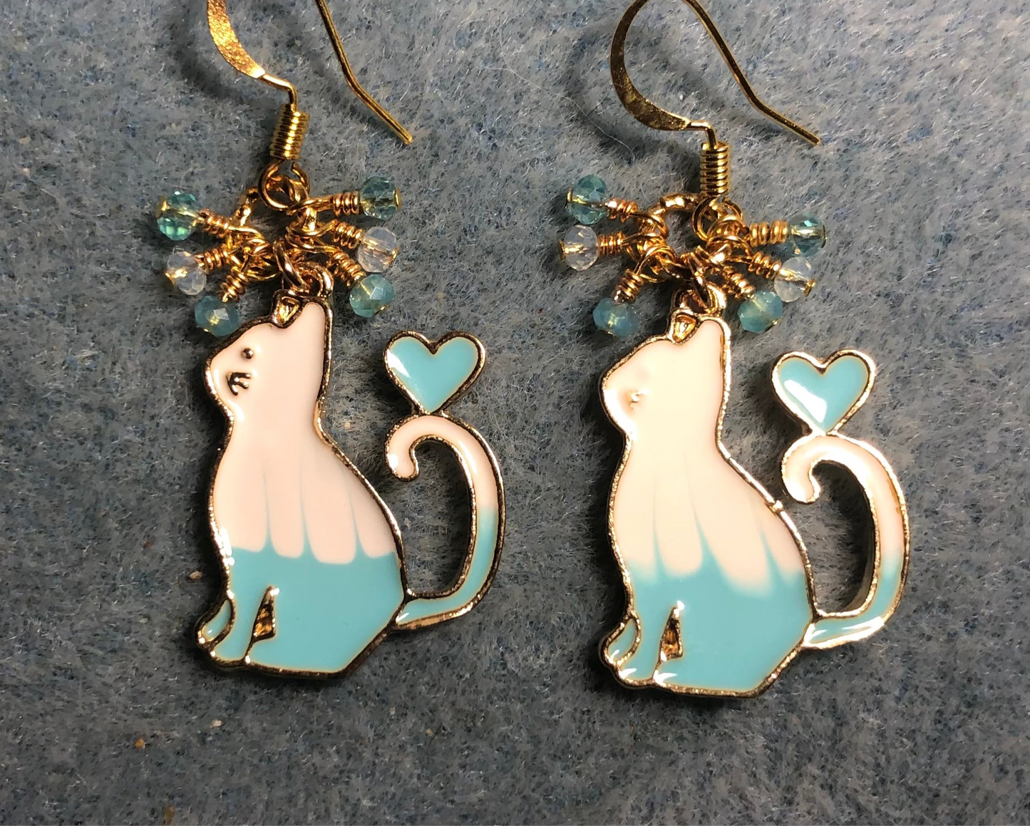 Turquoise and white enamel cat charm earrings adorned with tiny dangling turquoise and white Chinese crystal beads.