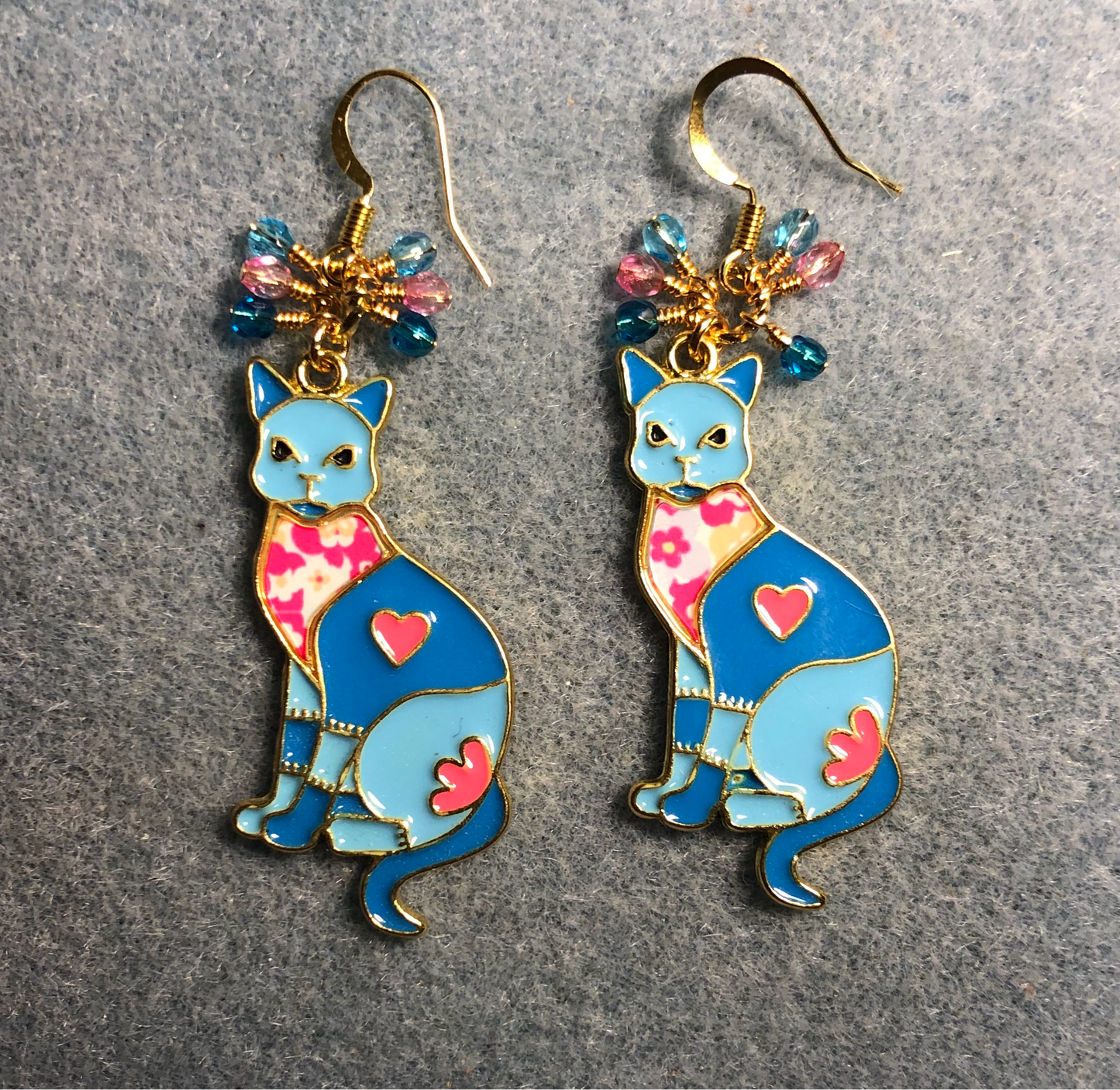 Large turquoise and pink enamel cat charm earrings adorned with small dangling turquoise and pink Czech glass beads.