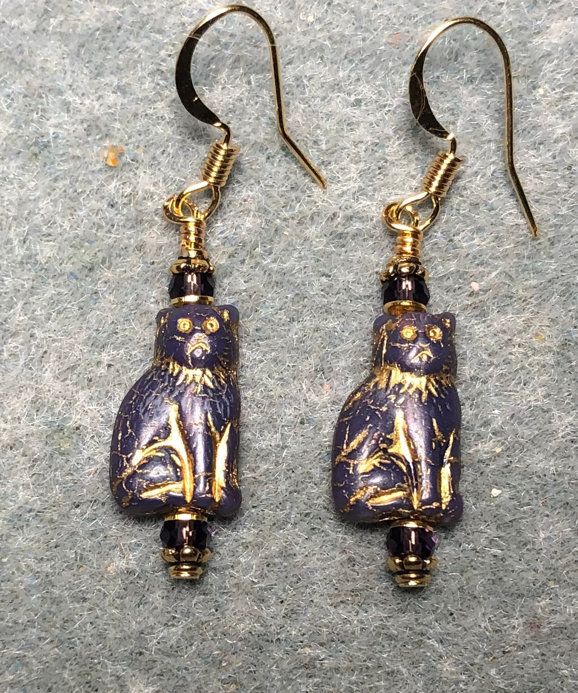 Small opaque purple (with gold inlay) Czech glass cat bead earrings adorned with purple Chinese crystal beads.