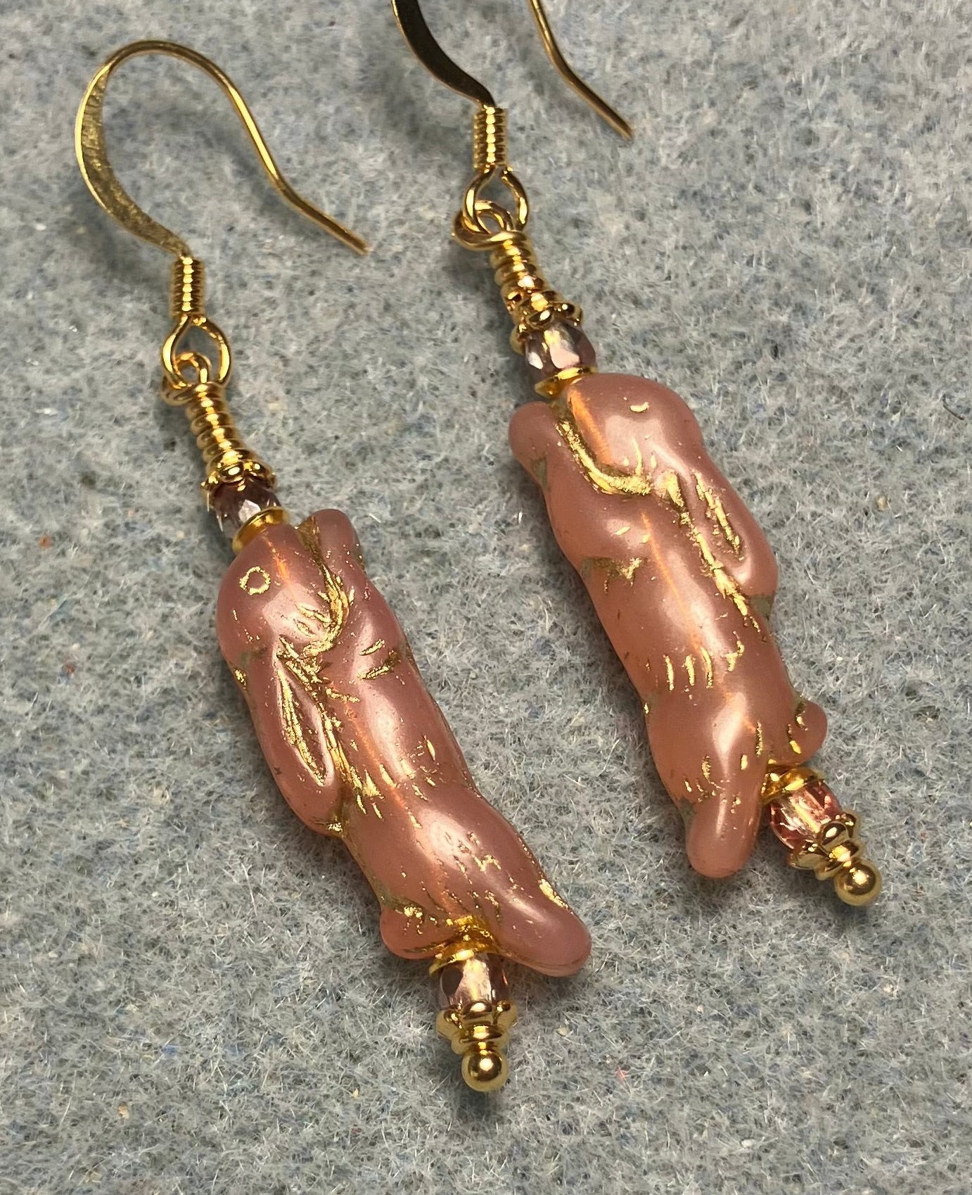 Small rose pink (with gold inlay) Czech glass bunny rabbit bead earrings adorned with small rose pink Czech glass beads.