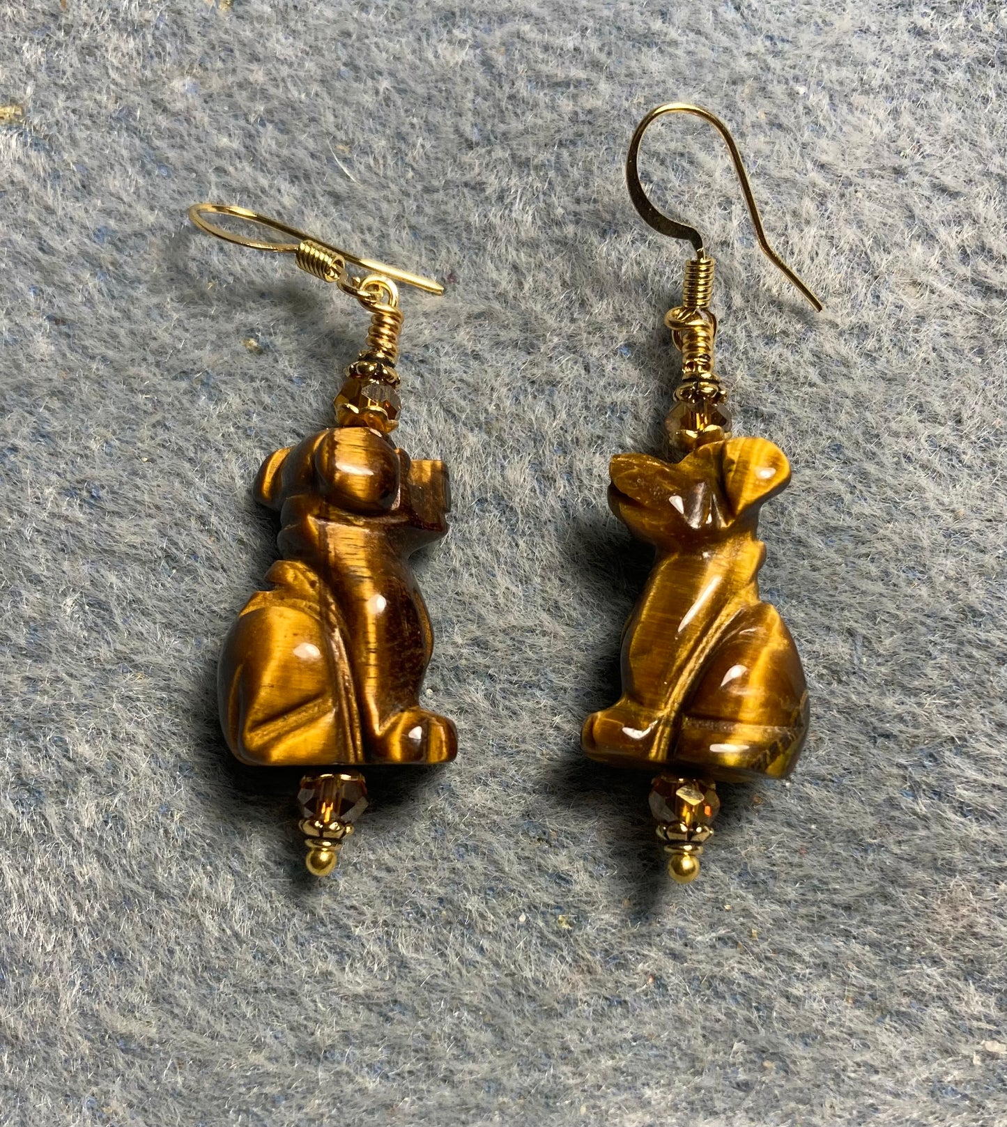 Brown tigereye gemstone dog bead earrings adorned with topaz Chinese crystal beads.