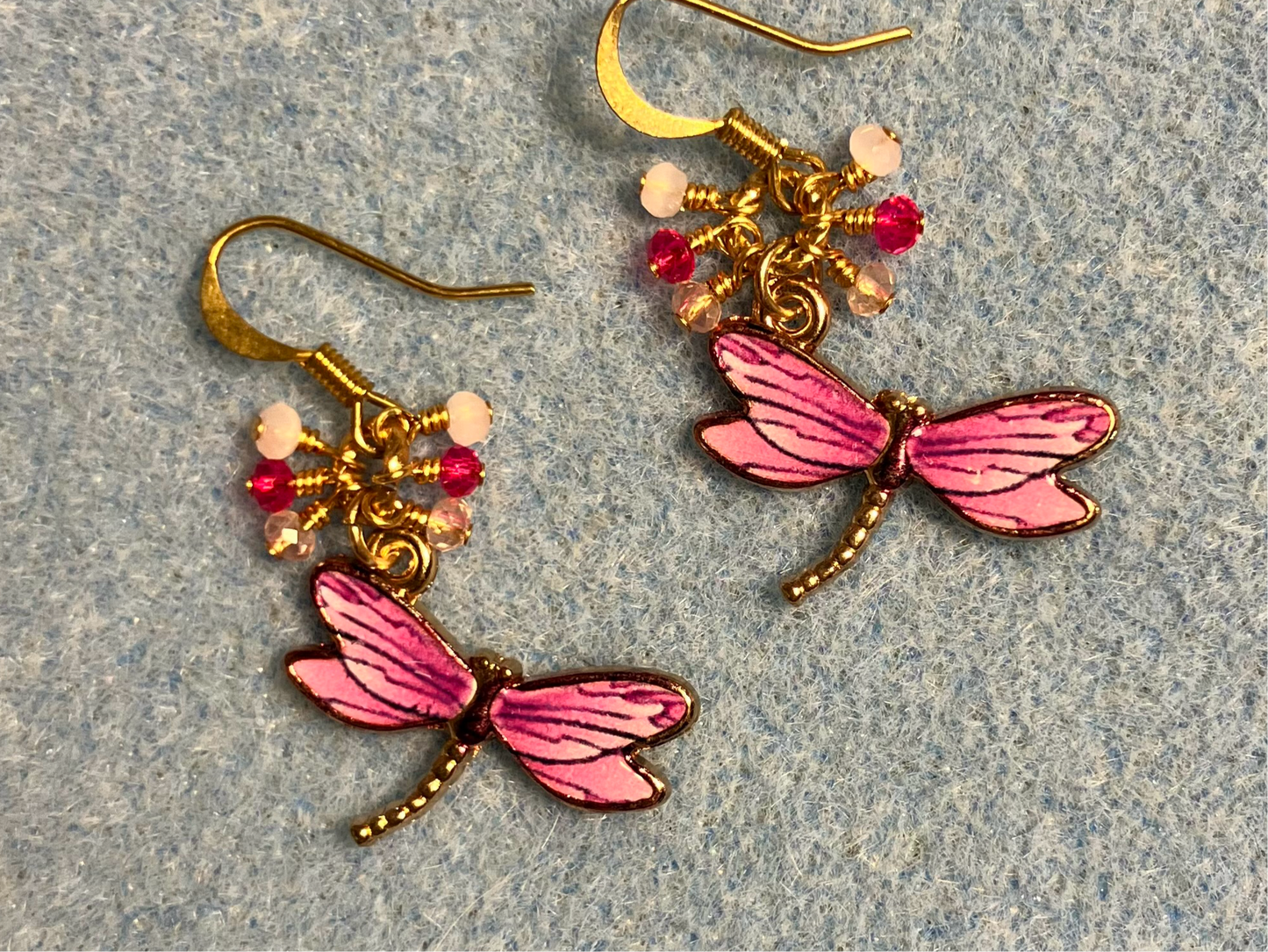 Purplish pink enamel dragonfly charm earrings adorned with tiny dangling purple and pink Chinese crystal beads.