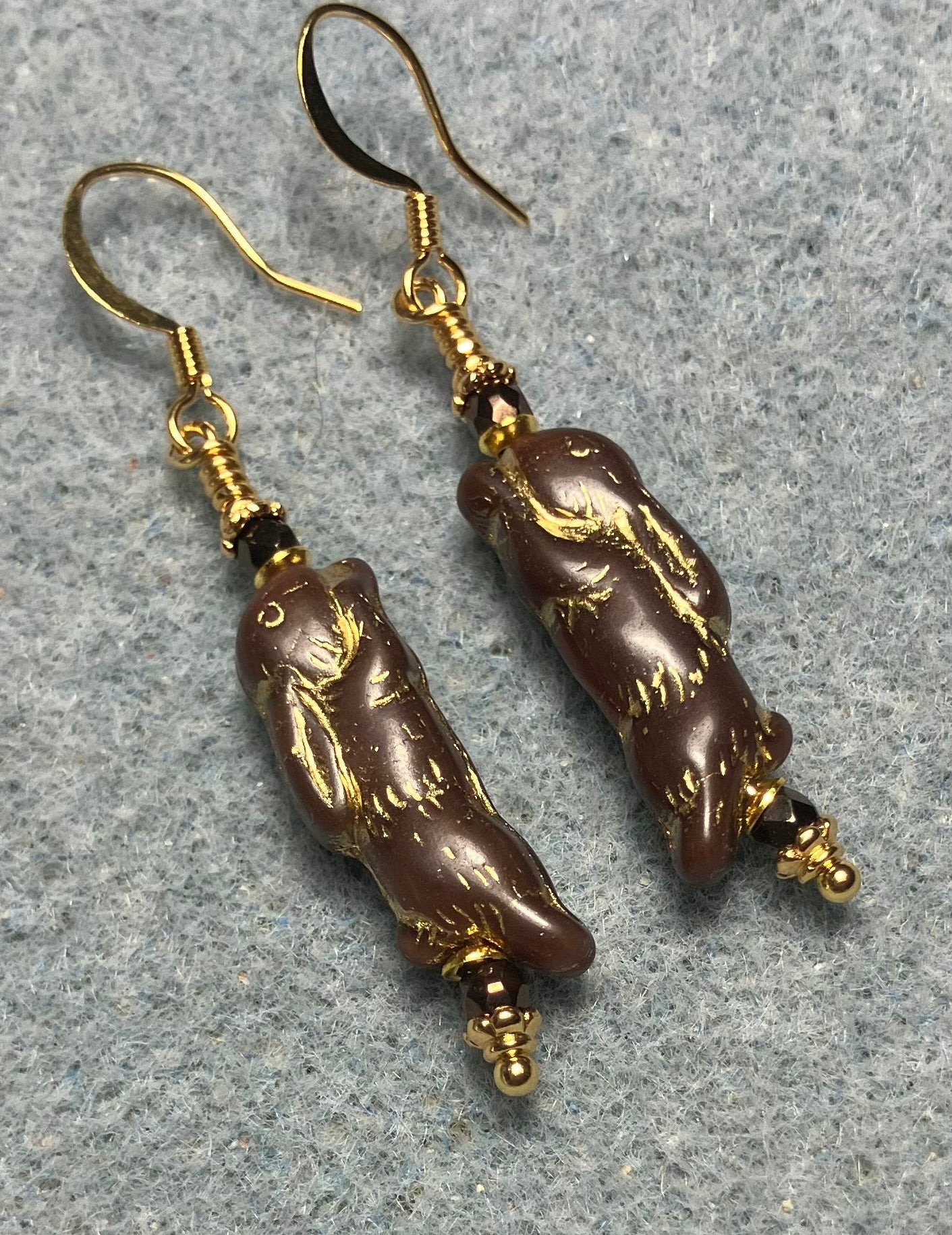 Small brown (with gold inlay) Czech glass bunny rabbit bead earrings adorned with small brown Czech glass beads.