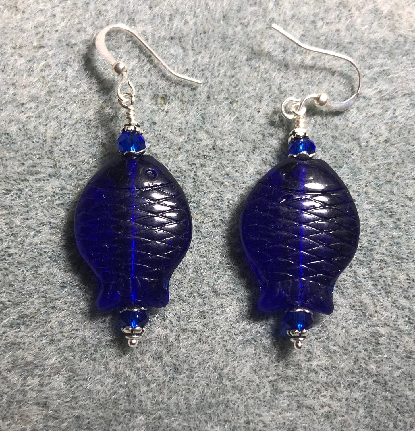 Dark blue Czech glass fish bead earrings adorned with dark blue Chinese crystal beads.