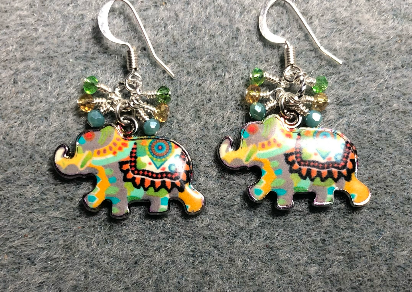 Green, yellow, and aqua enamel elephant charm earrings adorned with tiny dangling green, yellow, and aqua Chinese crystal beads.