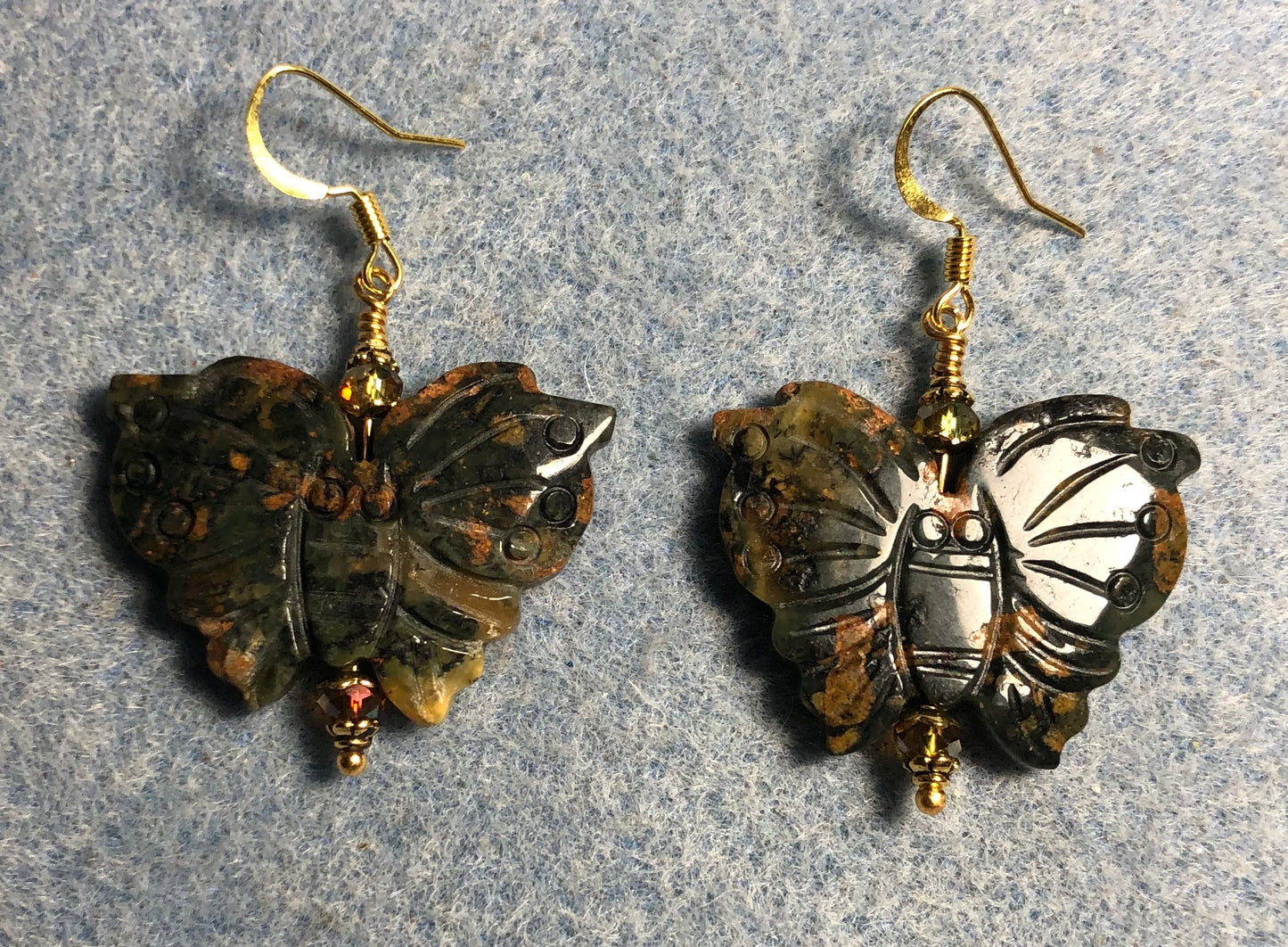 Large rainforest jasper gemstone butterfly bead earrings adorned with sparkly green Chinese crystal beads.