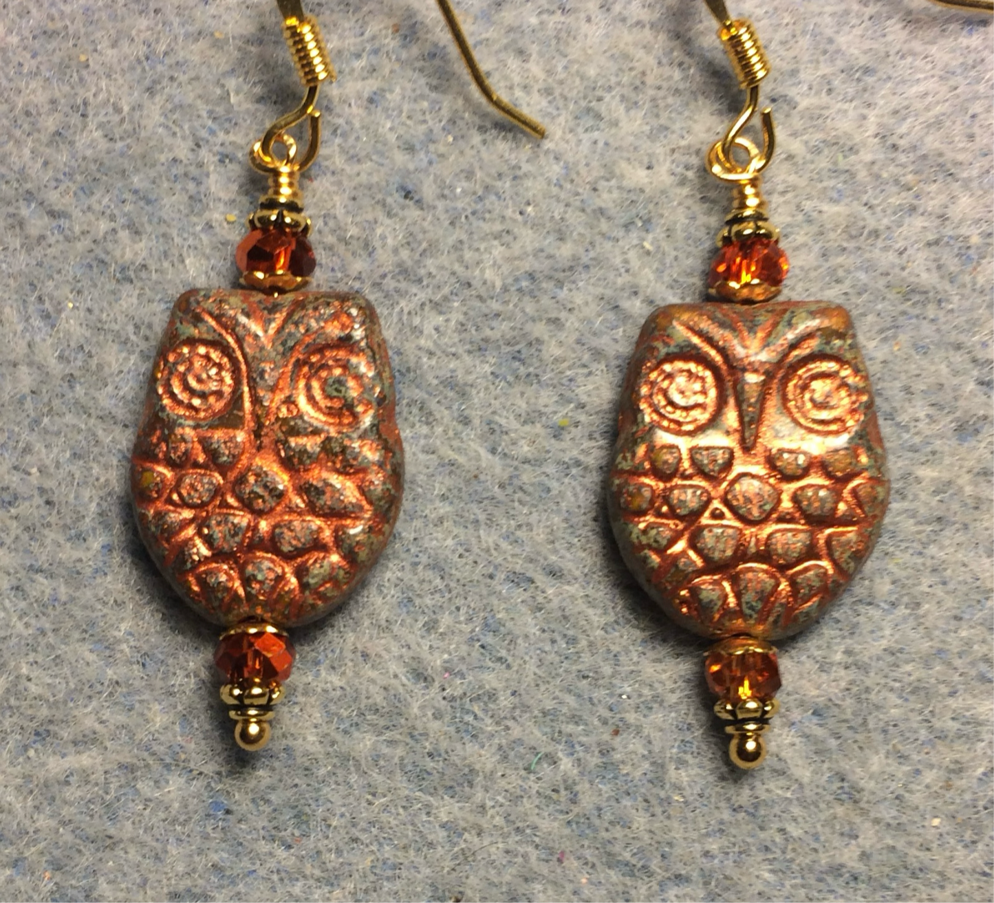 Brown orange (with copper wash) Czech glass owl bead earrings adorned with sparkly orange Chinese crystal beads.