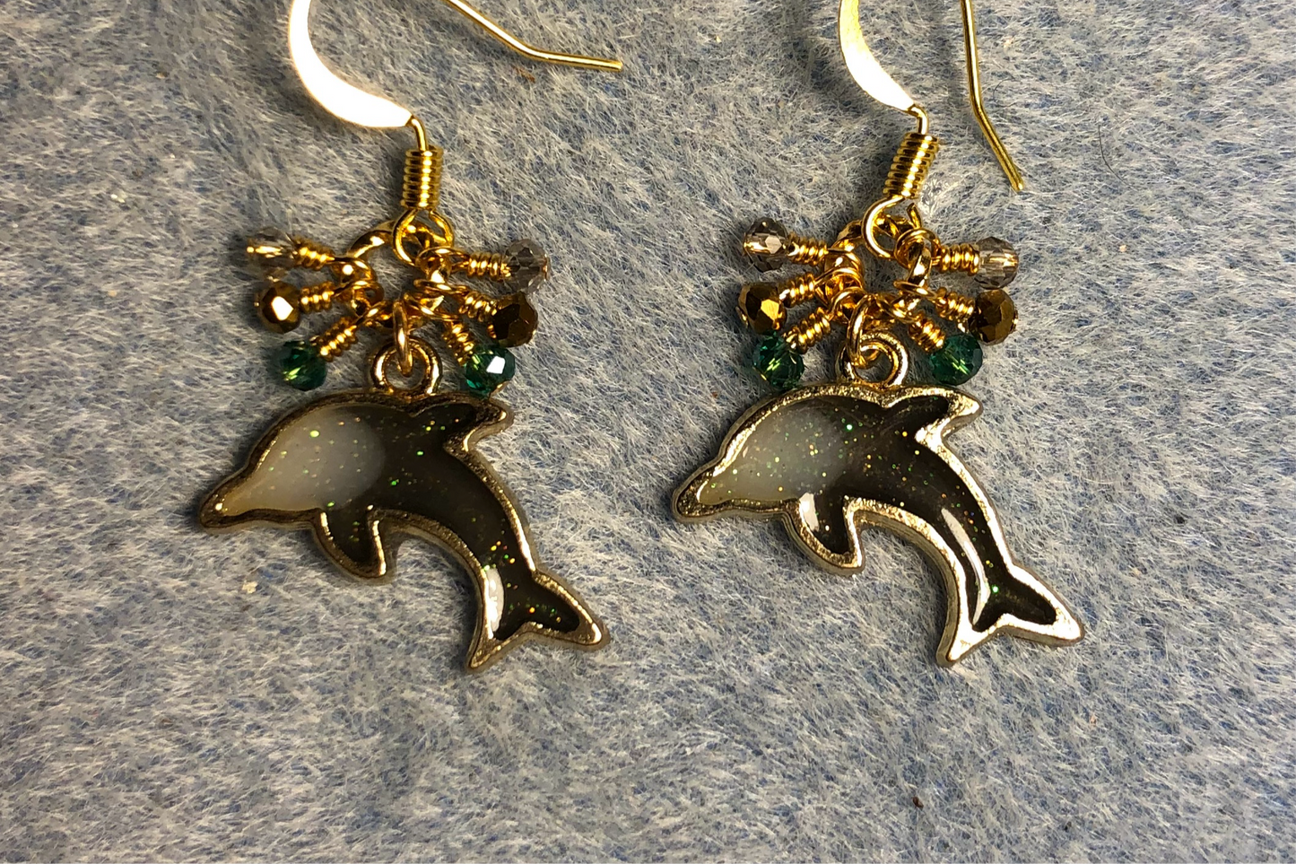 Gray and gold resin dolphin charm earrings adorned with tiny dangling gray,teal and gold Chinese crystal beads.
