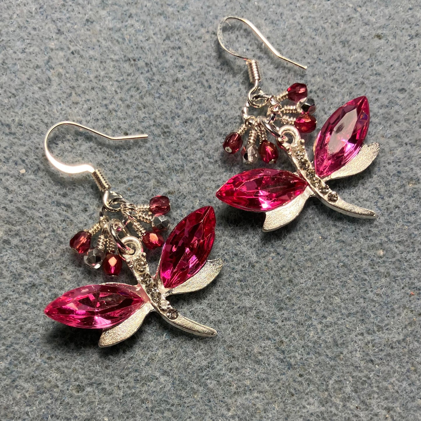 Hot pink and silver rhinestone dragonfly charm earrings adorned with small dangling hot pink and silver Czech glass beads.