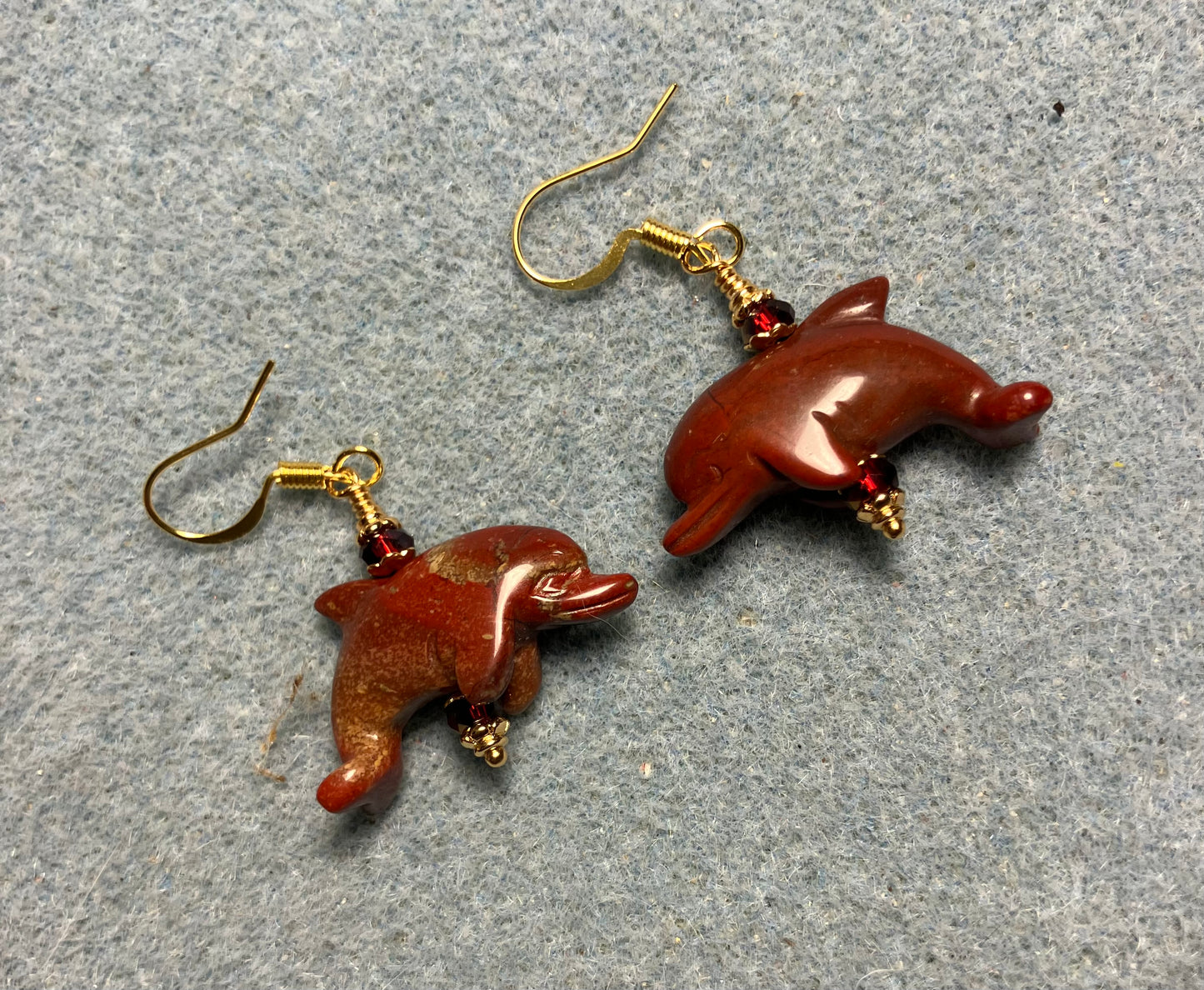 Dark red poppy jasper gemstone dolphin bead earrings adorned with dark red Chinese crystal beads.