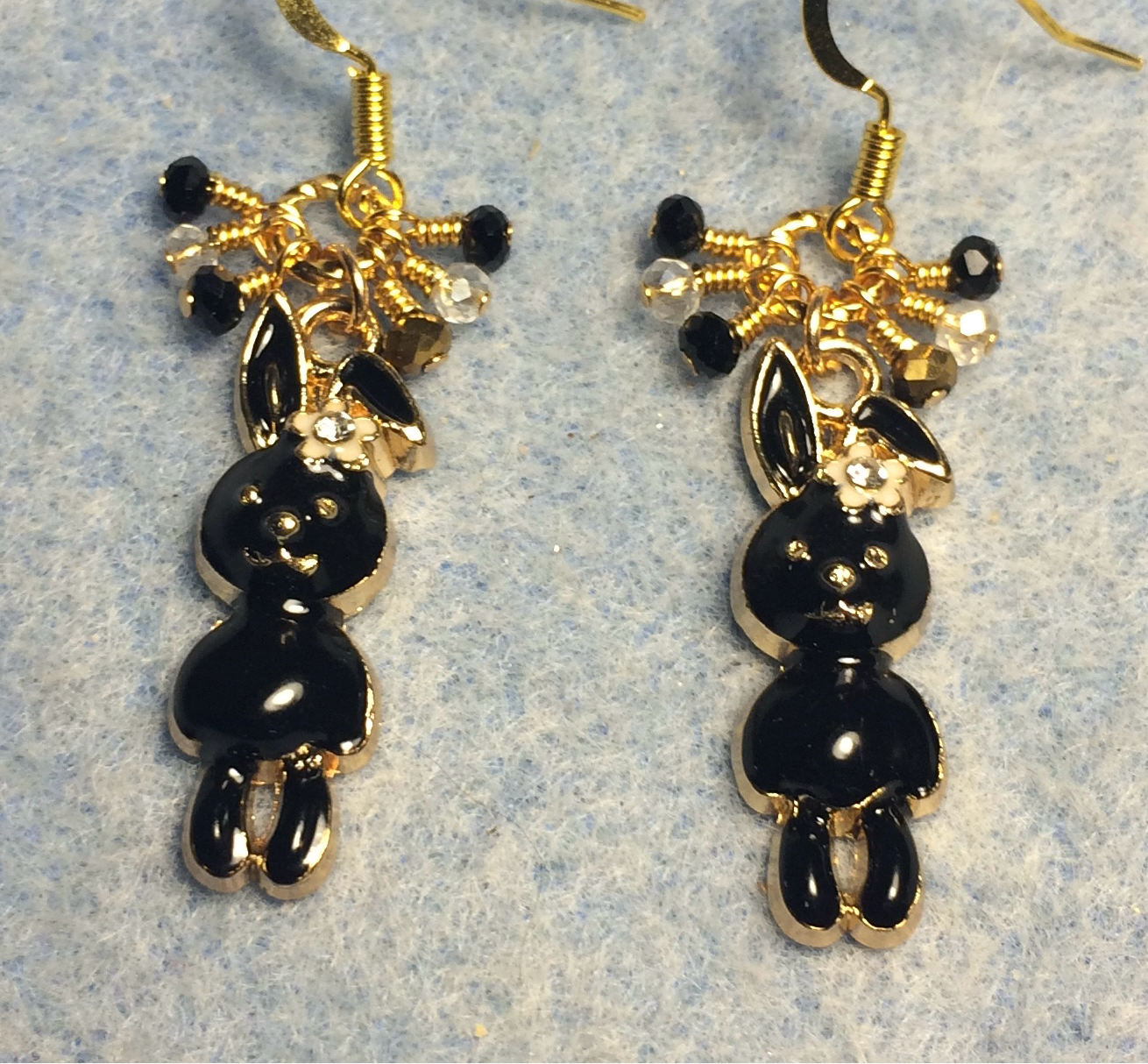 Black enamel and rhinestone rabbit charm earrings adorned with black and clear Chinese crystal beads.
