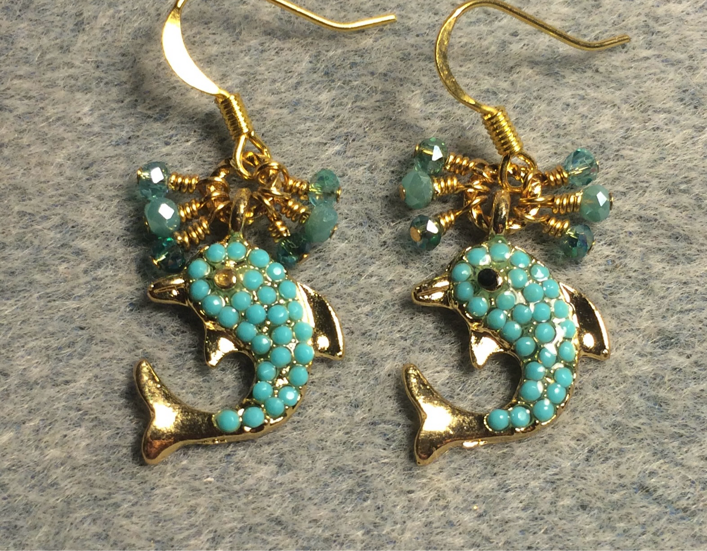 Gold and aqua enamel dolphin charm earrings adorned with tiny dangling aqua Chinese crystal beads.