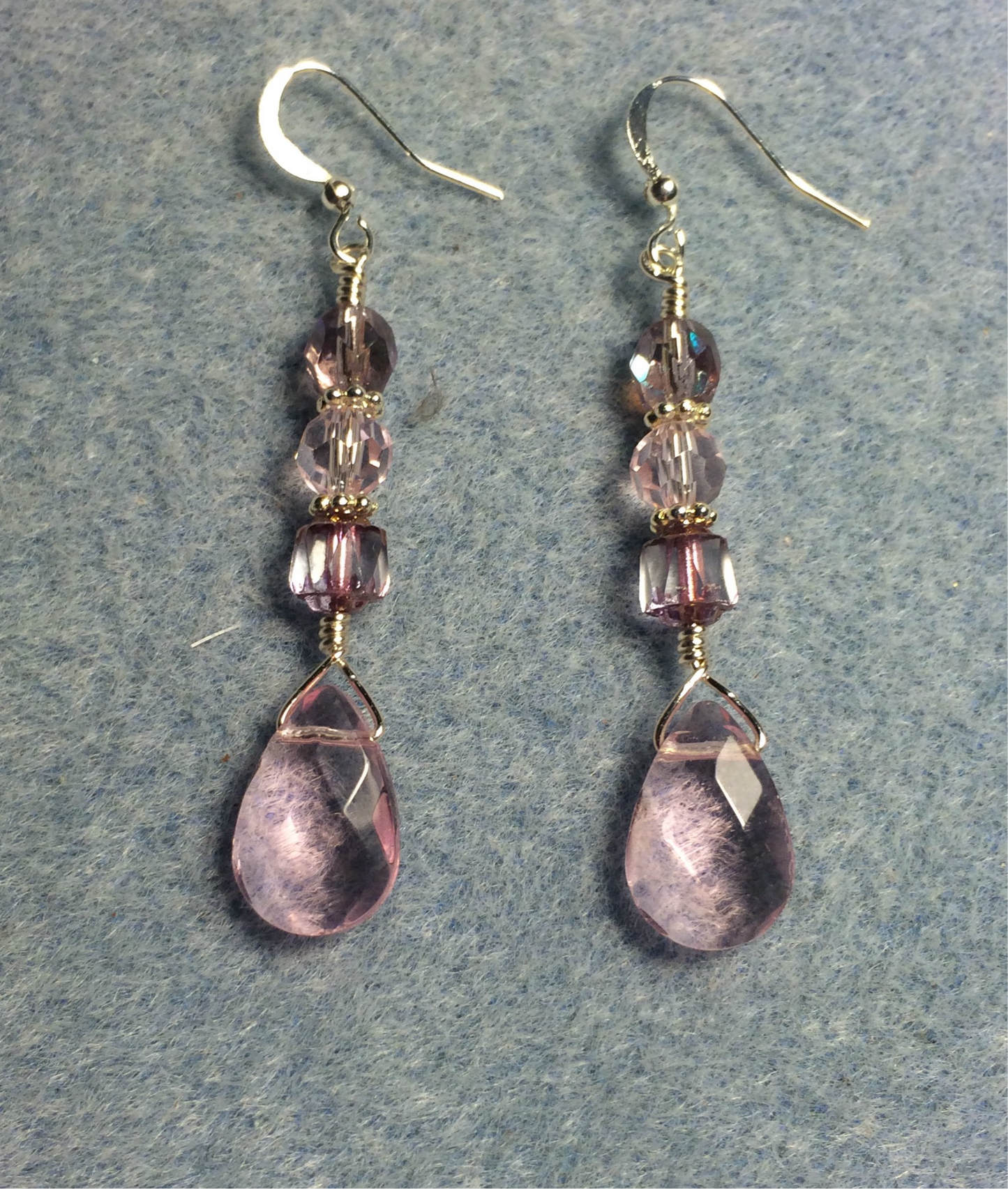 Light pink Czech glass briolette bead earrings adorned with light pink Czech glass beads.