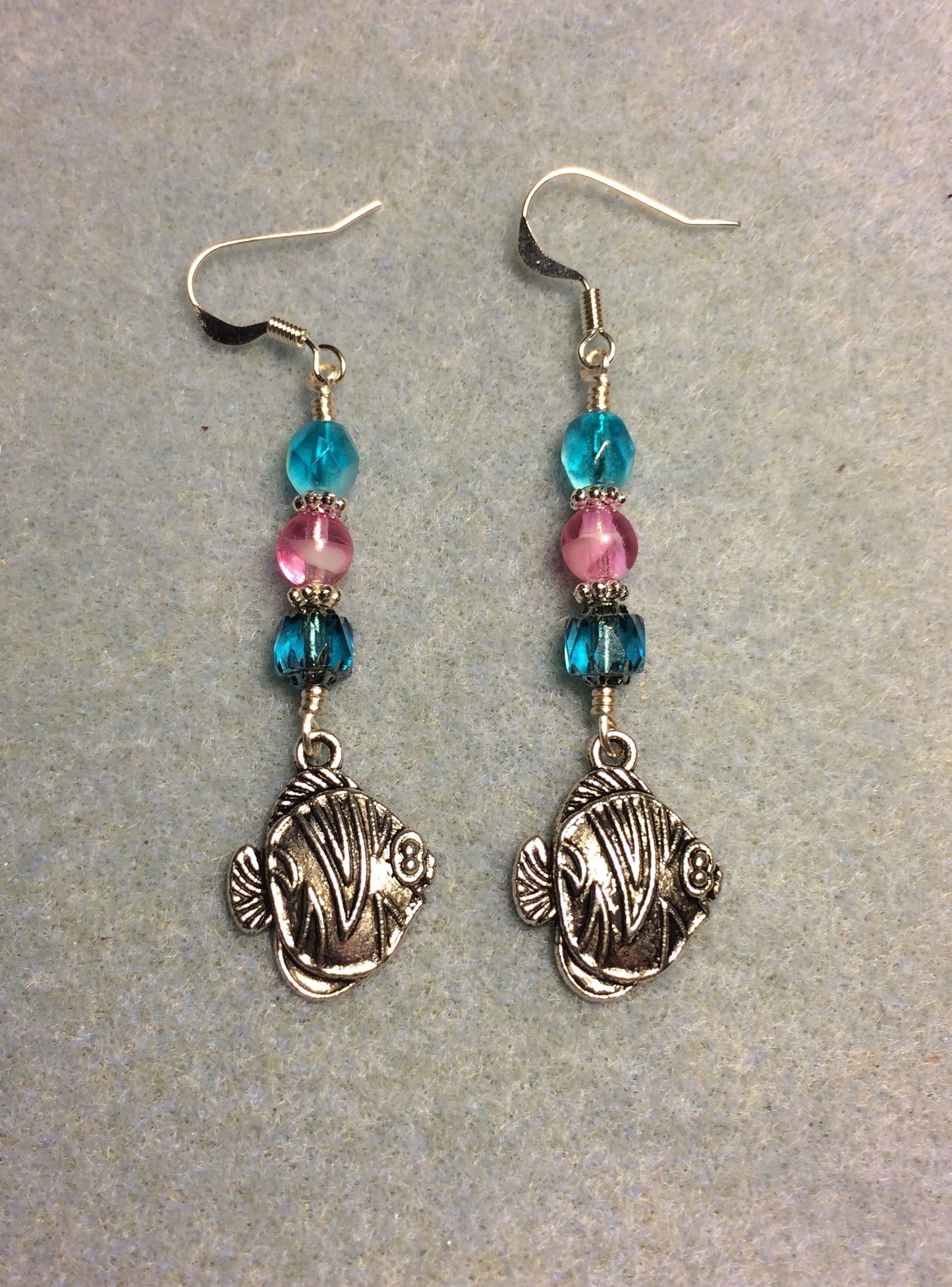Silver angelfish charm earrings adorned with turquoise and pink Czech glass beads
