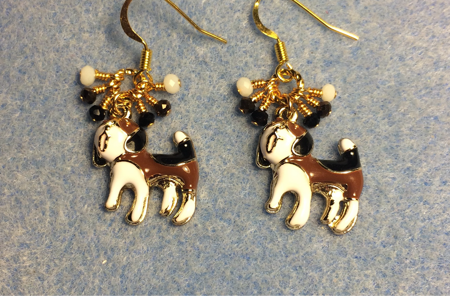 Brown, black, and white enamel dog charm earrings adorned with tiny dangling brown, black, and white Chinese crystal beads.