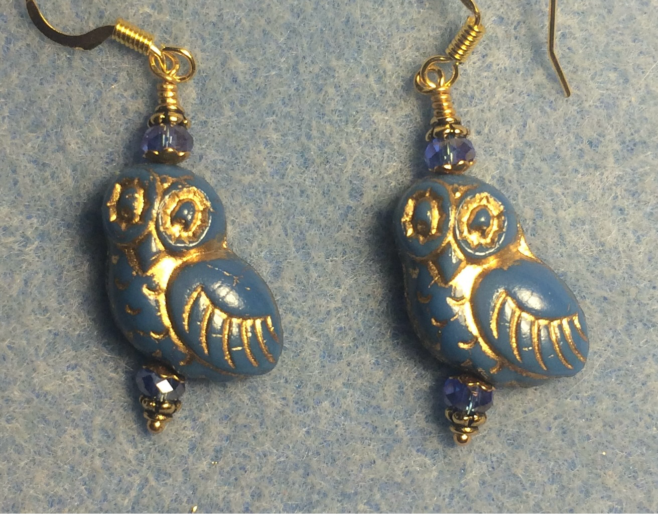 Royal blue (with gold wash) fancy Czech glass owl bead earrings adorned with blue Chinese crystal beads.