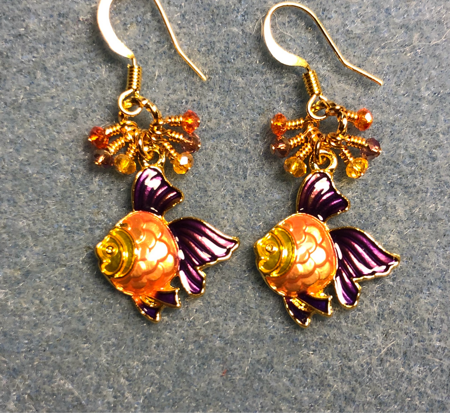 Amber, orange, and purple enamel angelfish charm earrings adorned with tiny dangling amber, orange, and purple Chinese crystal beads.