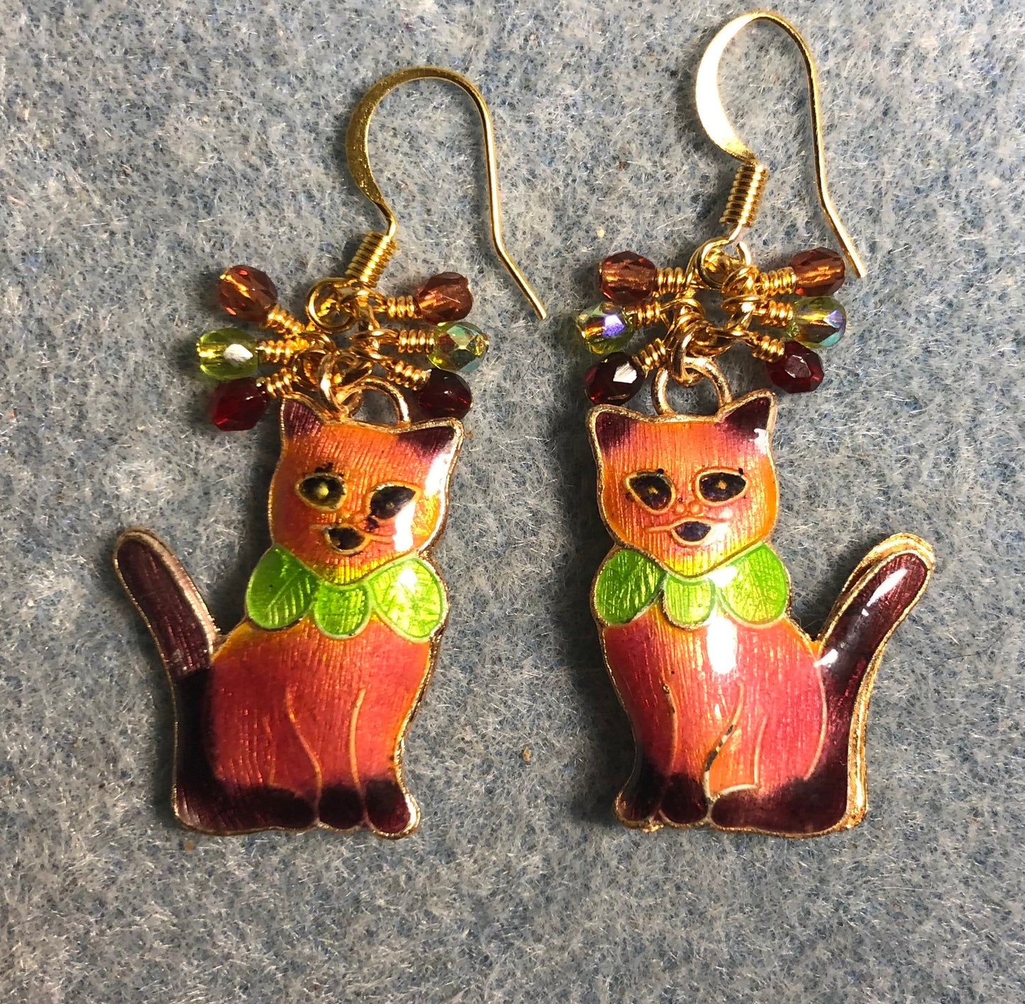 Coral, dark red, and olive green cloisonné cat charm earrings adorned with small dangling coral, dark red, and olive green Czech glass beads.