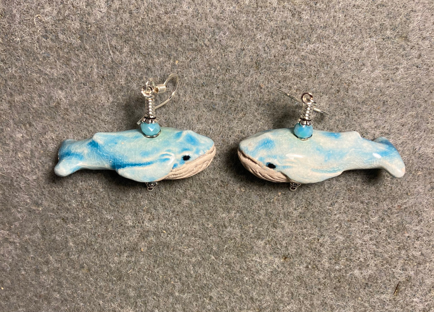 Turquoise and white ceramic whale bead earrings adorned with turquoise Chinese crystal beads.