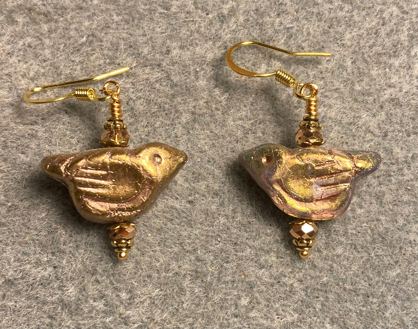 Gold Czech glass bird bead earrings adorned with gold Chinese crystal beads.