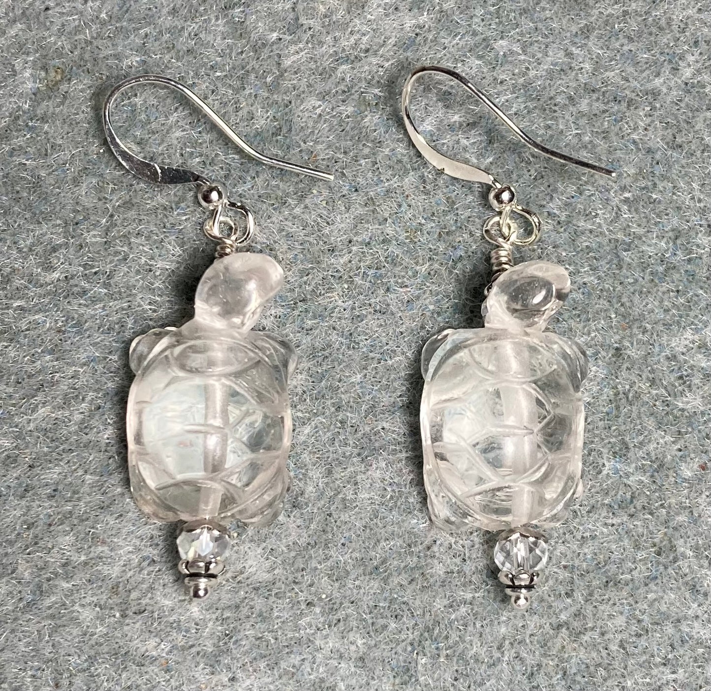 Clear rock crystal gemstone turtle bead earrings adorned with clear Chinese crystal beads.