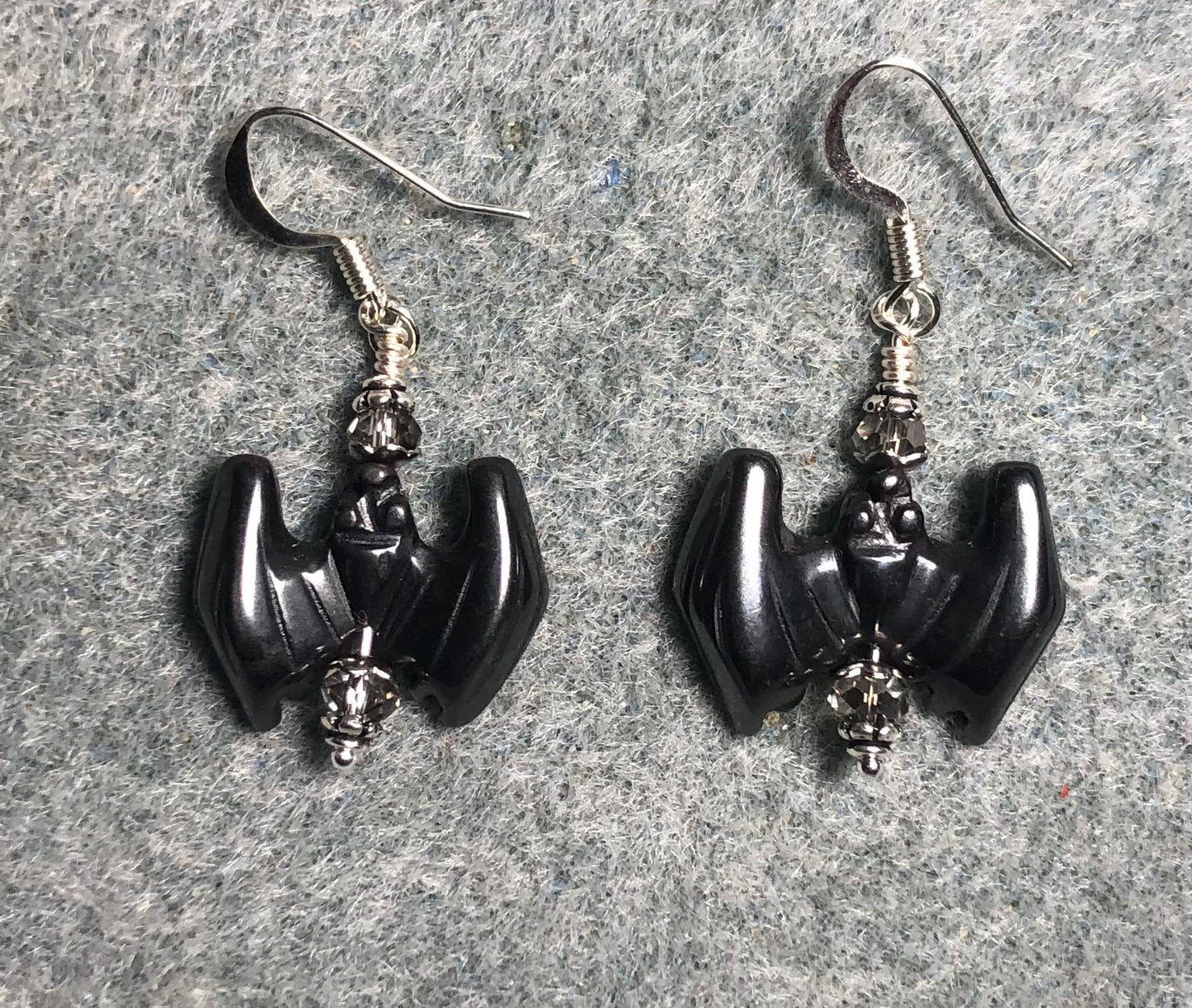 Hematite gemstone bat bead earrings adorned with gray Chinese crystal beads.