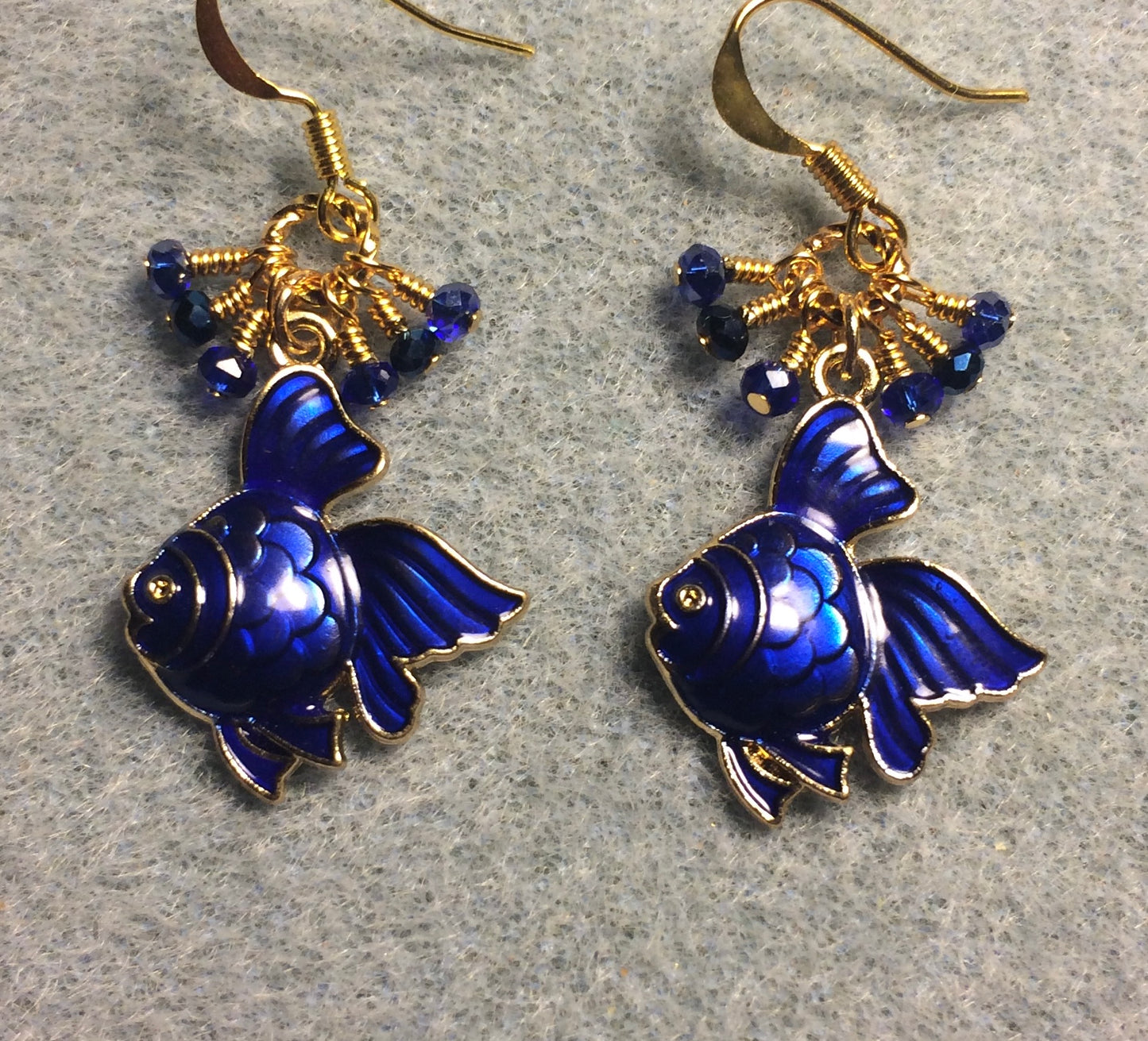 Dark blue enamel angelfish charm earrings adorned with tiny dangling dark blue Chinese crystal beads.
