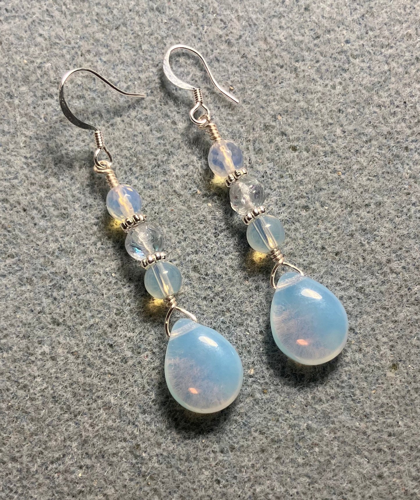 Opal white Czech glass pear drop bead earrings adorned with opal white Czech glass beads.