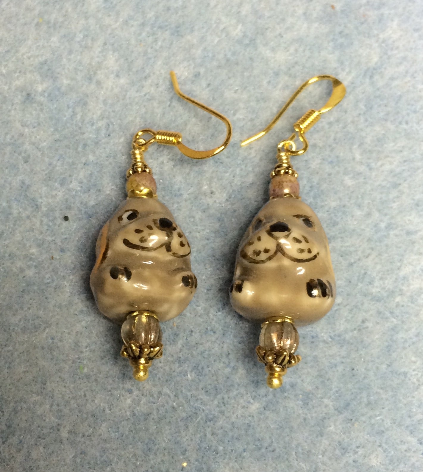 Tan ceramic puppy dog bead earrings adorned with tan Czech glass beads.
