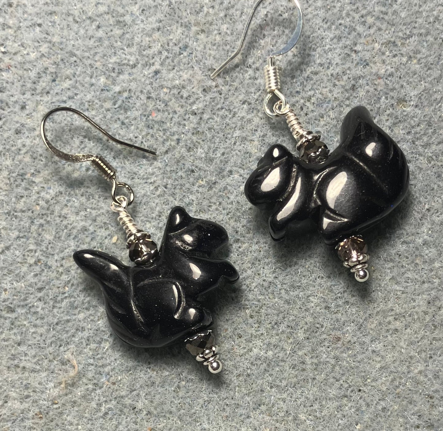 Blue goldstone gemstone squirrel bead earrings adorned with purple Chinese crystal beads.