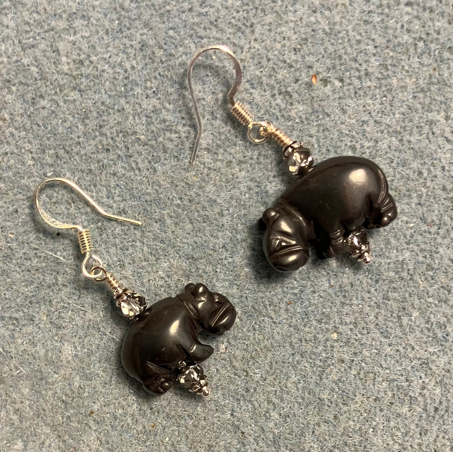 Gray hematite gemstone hippo bead earrings adorned with gray Chinese crystal beads.